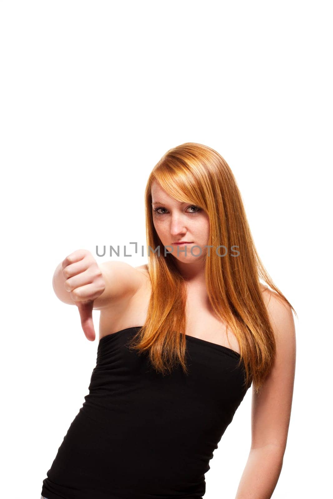 Redhead woman showing thumbs down on white background
