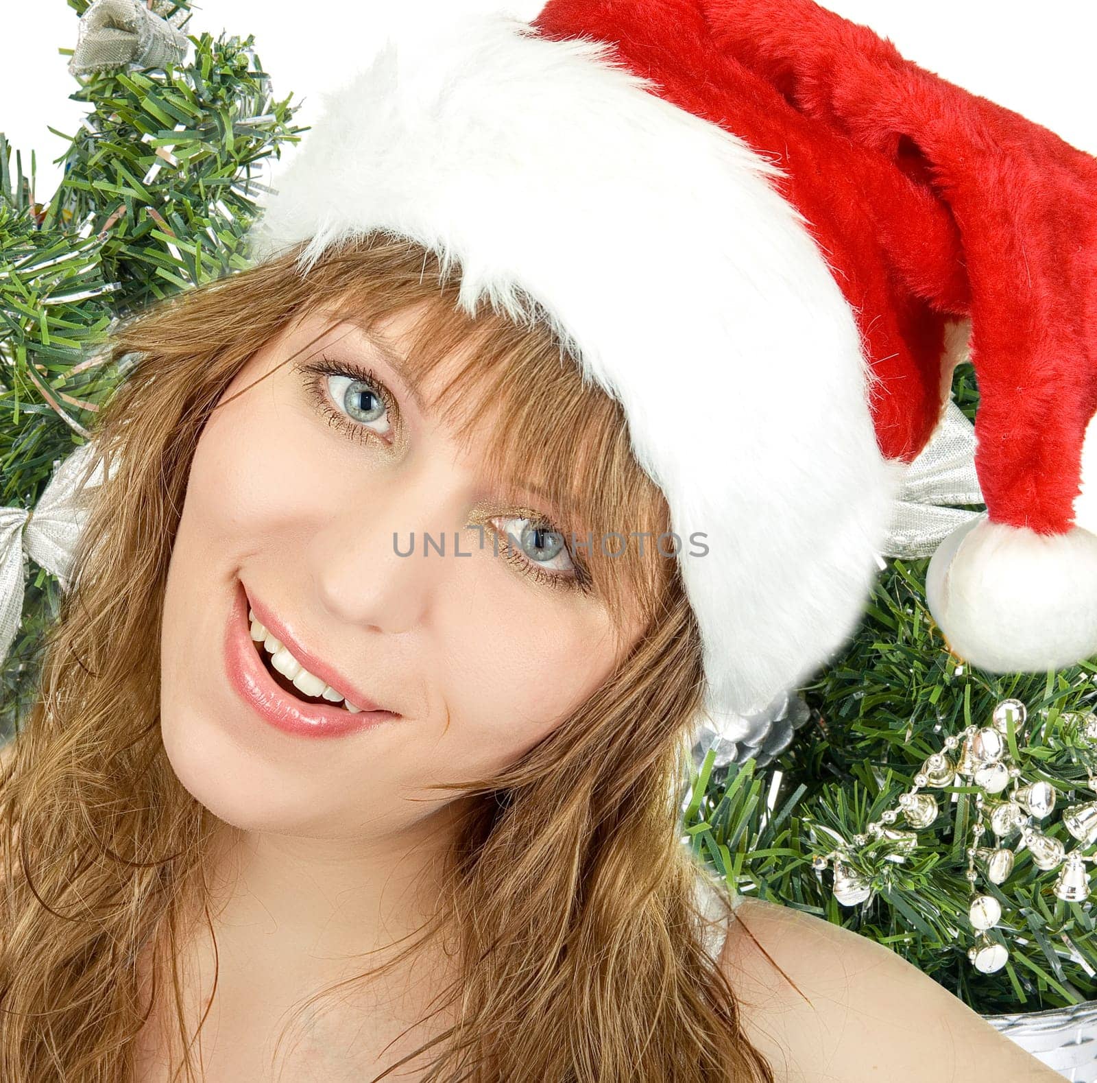 Happy pretty santa woman on firtree background