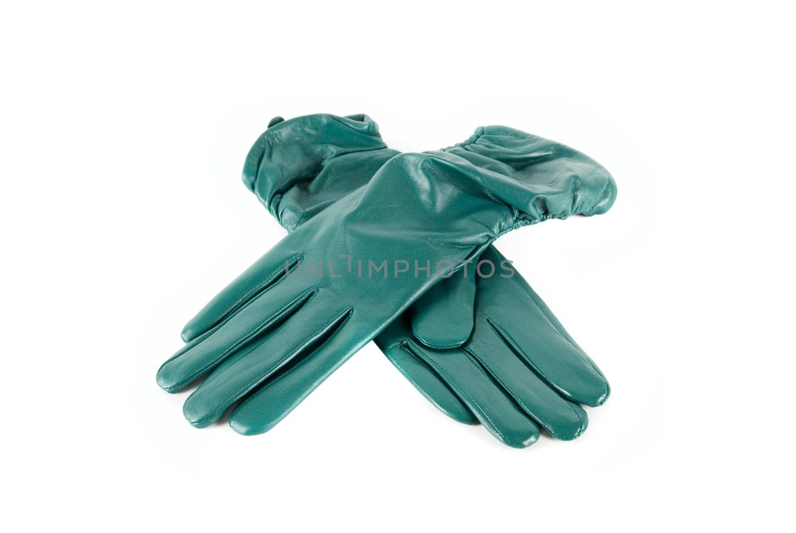 Green modern female leather gloves isolated on a white