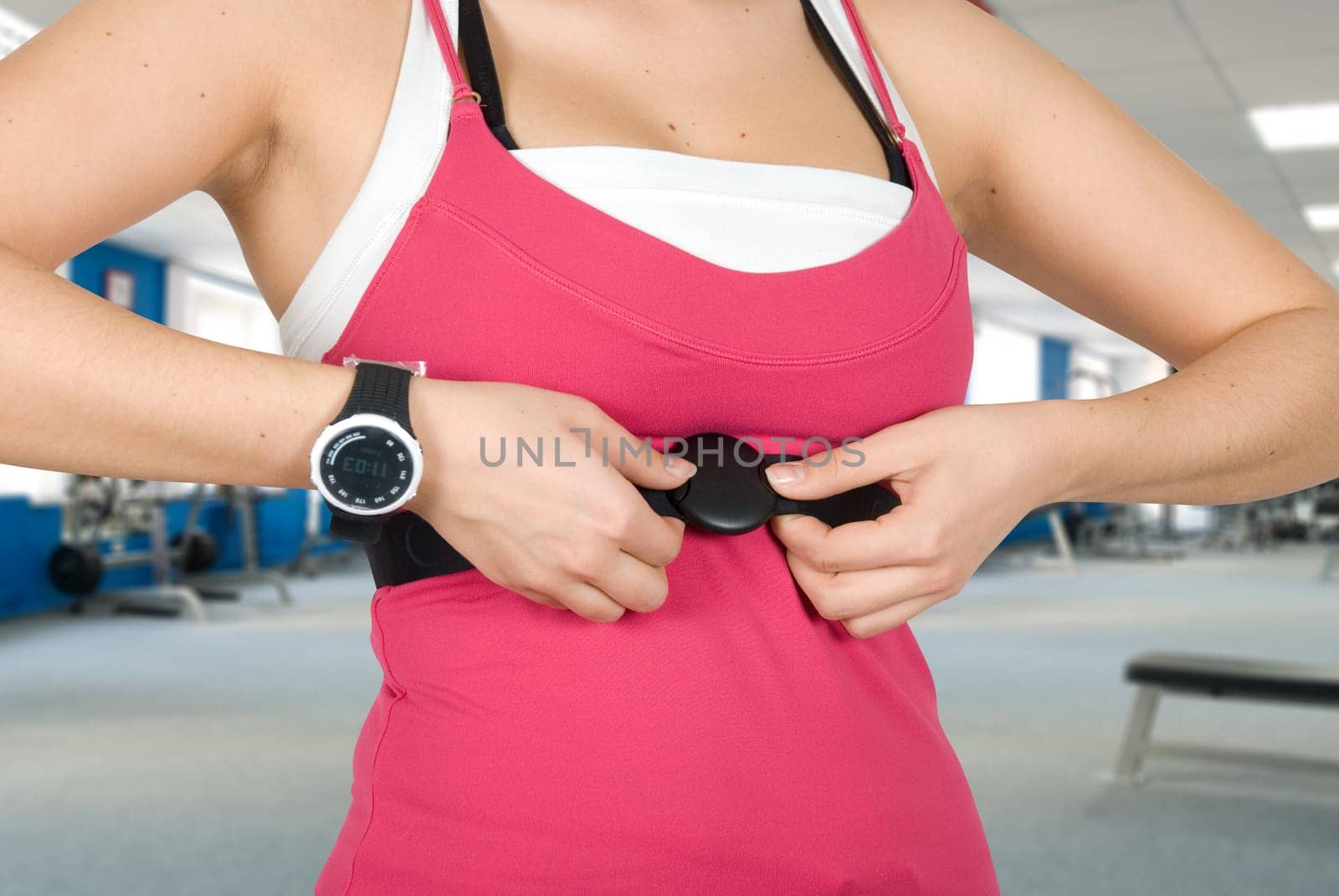 Girl with checking pulse watch closeup