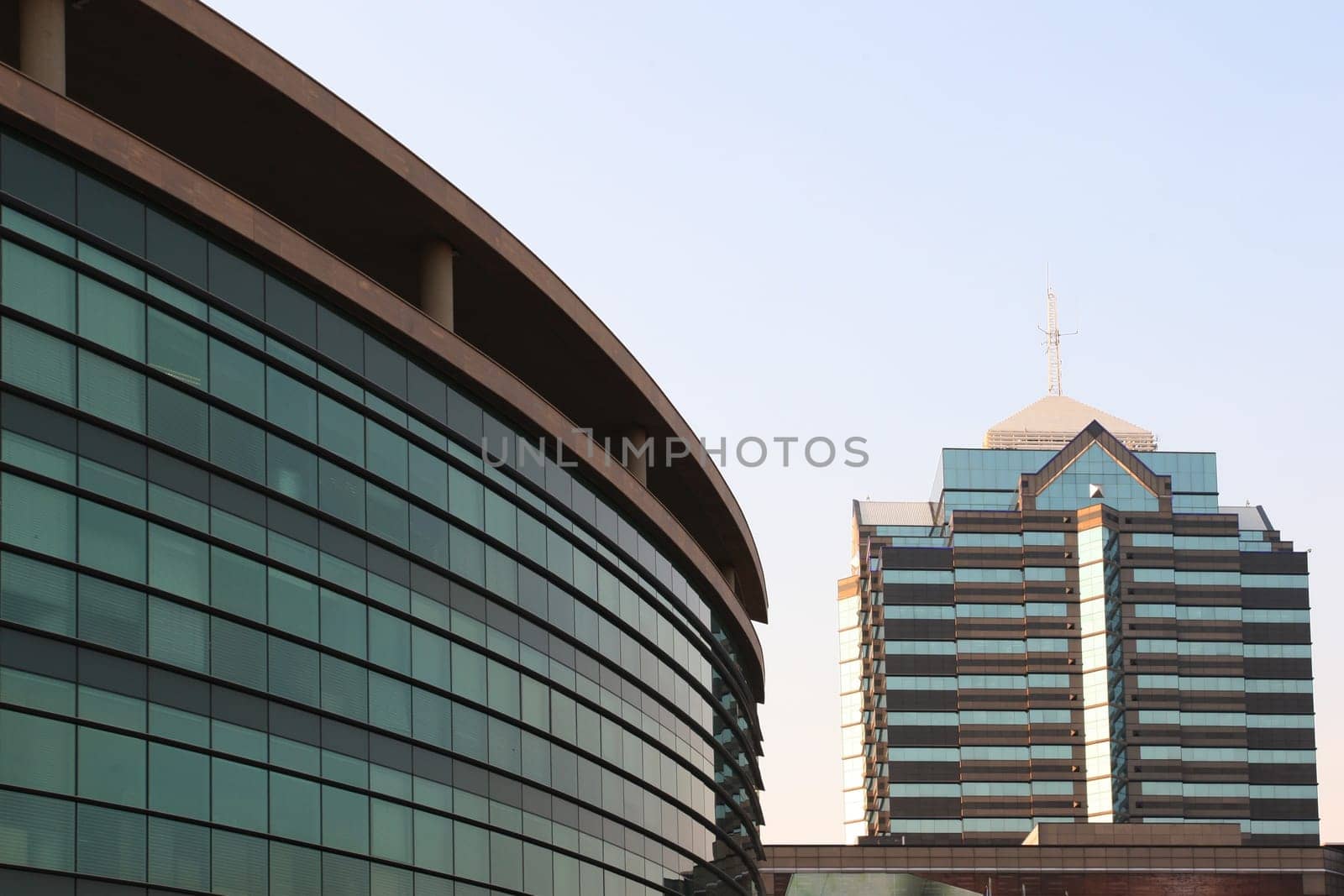 Modern commercial buildings with glass windows and geometrical shapes