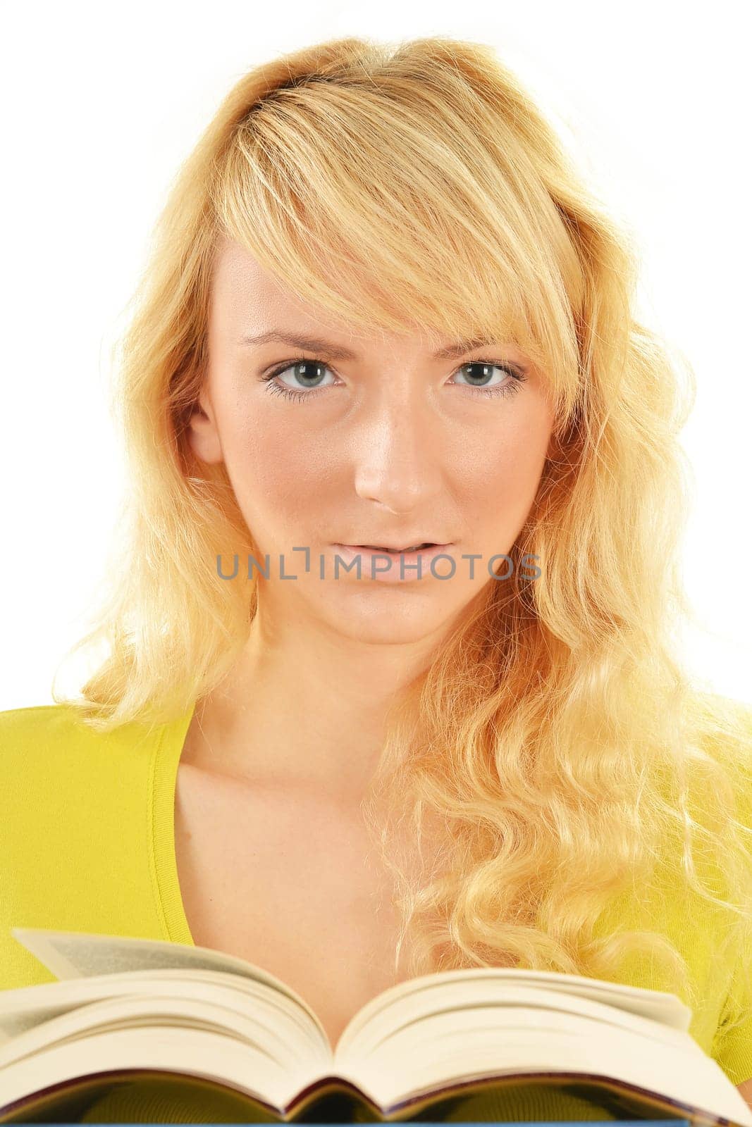 Portrait of young caucasian woman reading a book. Female student studying