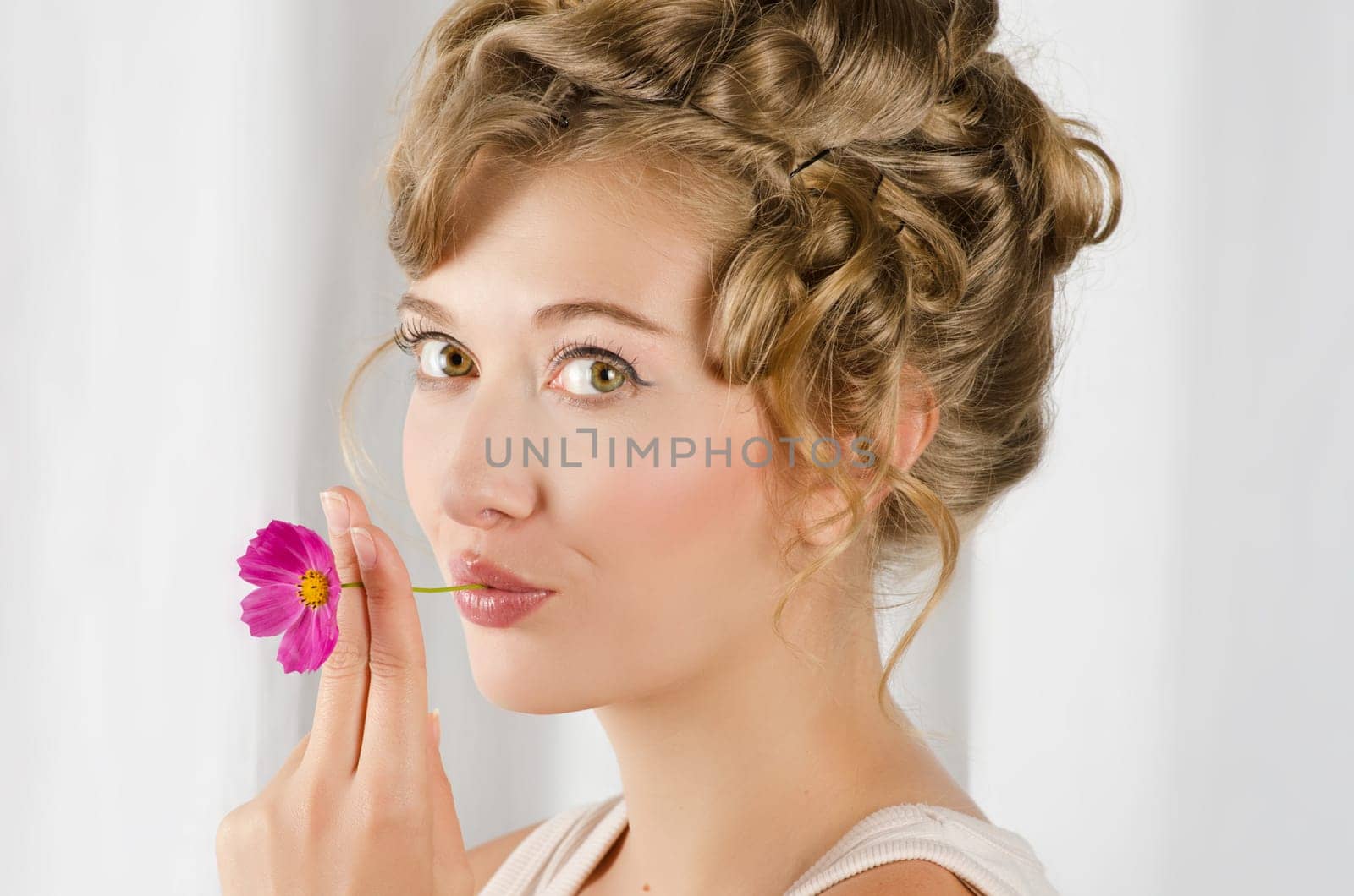 beauty woman closeup portrait with flower over grey background