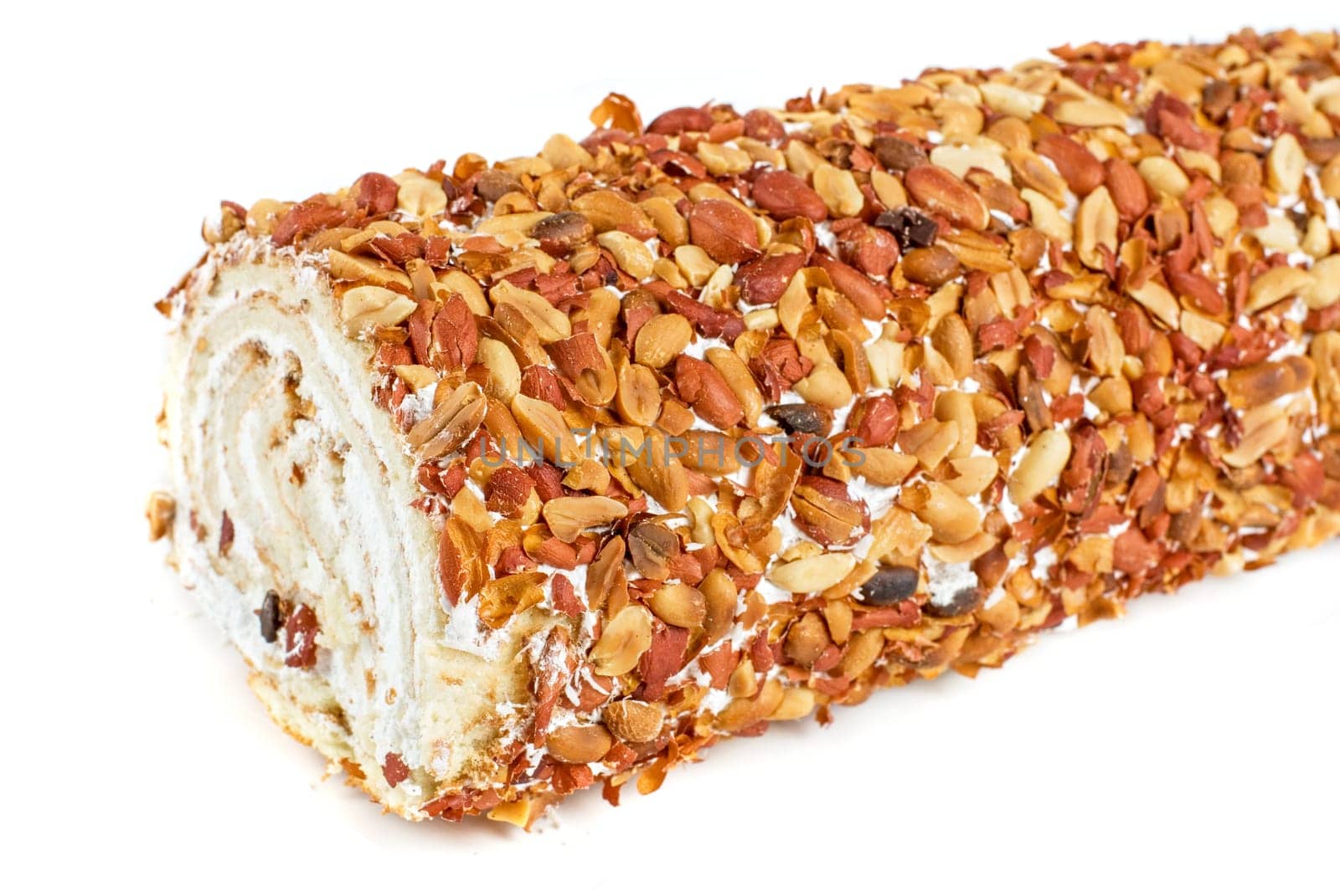 Nuts Swiss roll closeup isolated on a white background