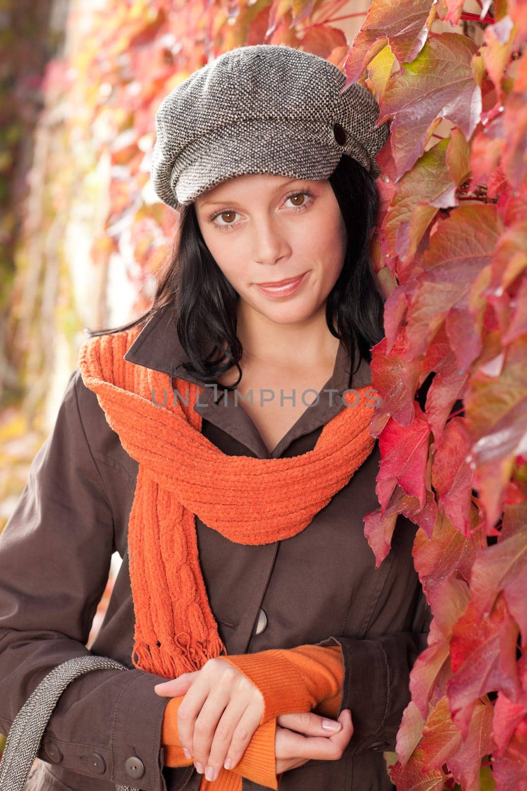 Autumn leaves portrait of beautiful female model posing fashion outfit