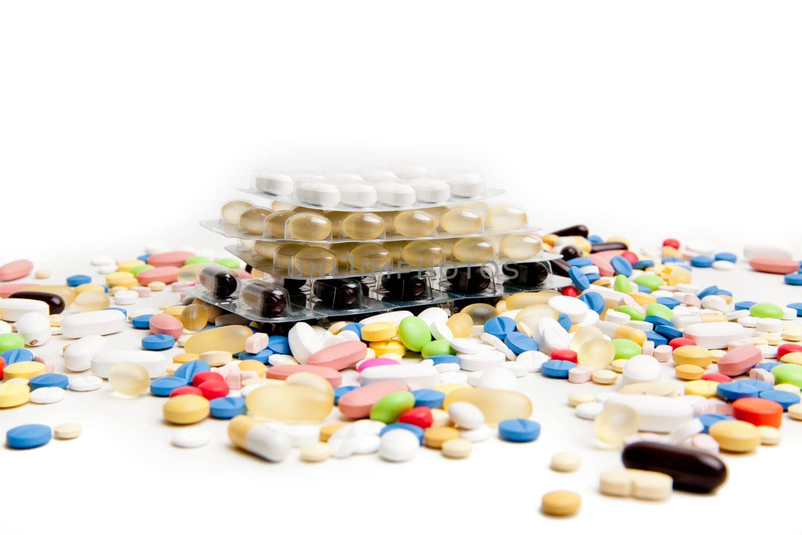 Medical concept created by pills . Isolated on white
