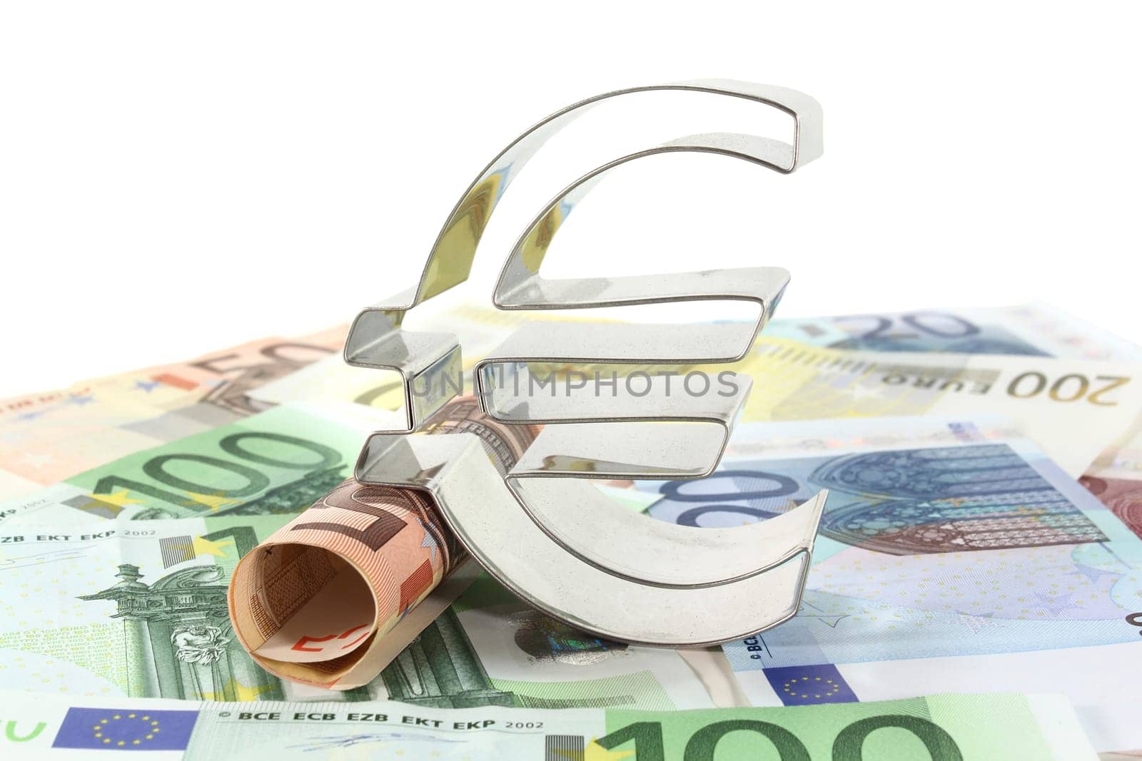 Euro bills and euro signs against white background