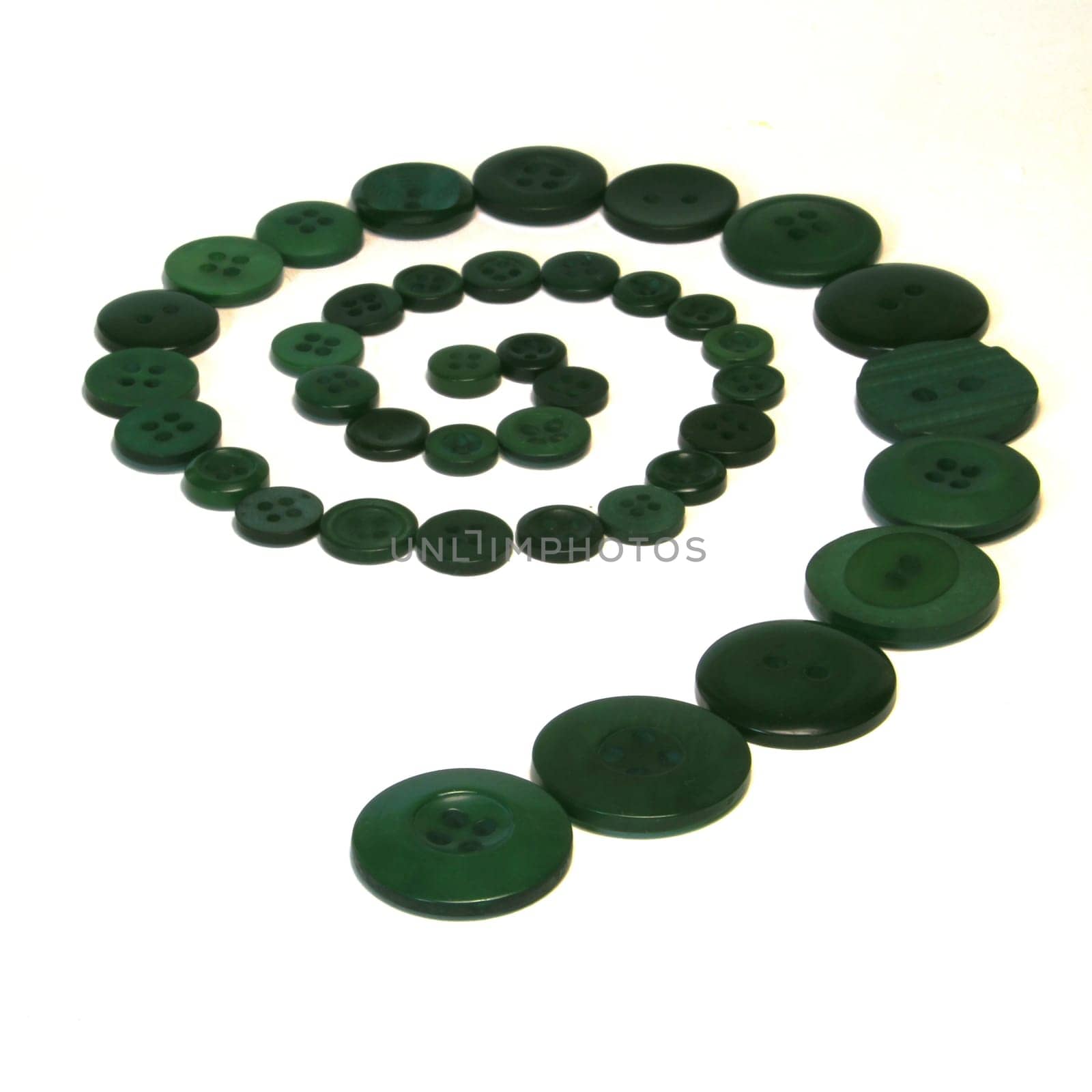 A series of green buttons in the shape of a spiral