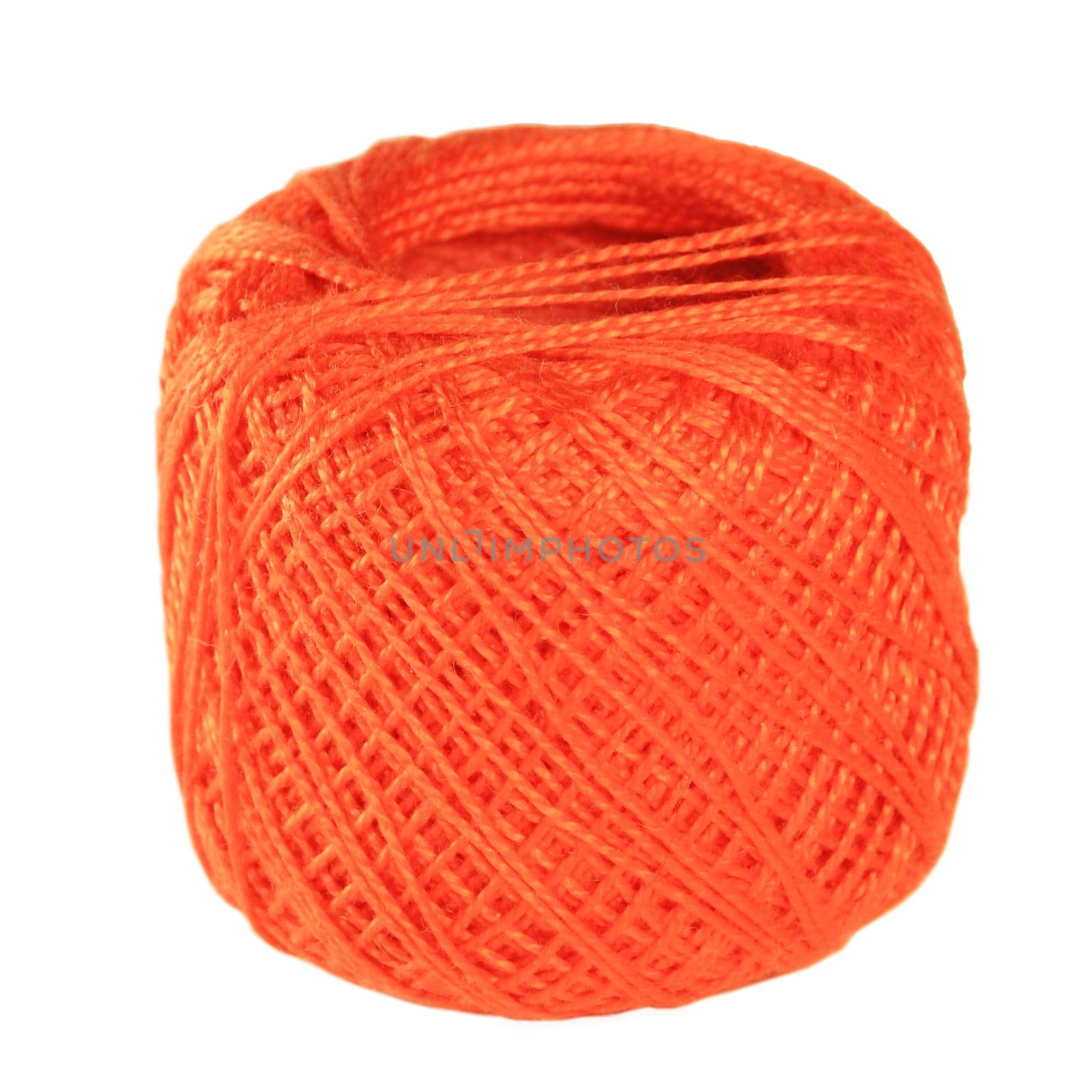 A ball of orange thread on a white background