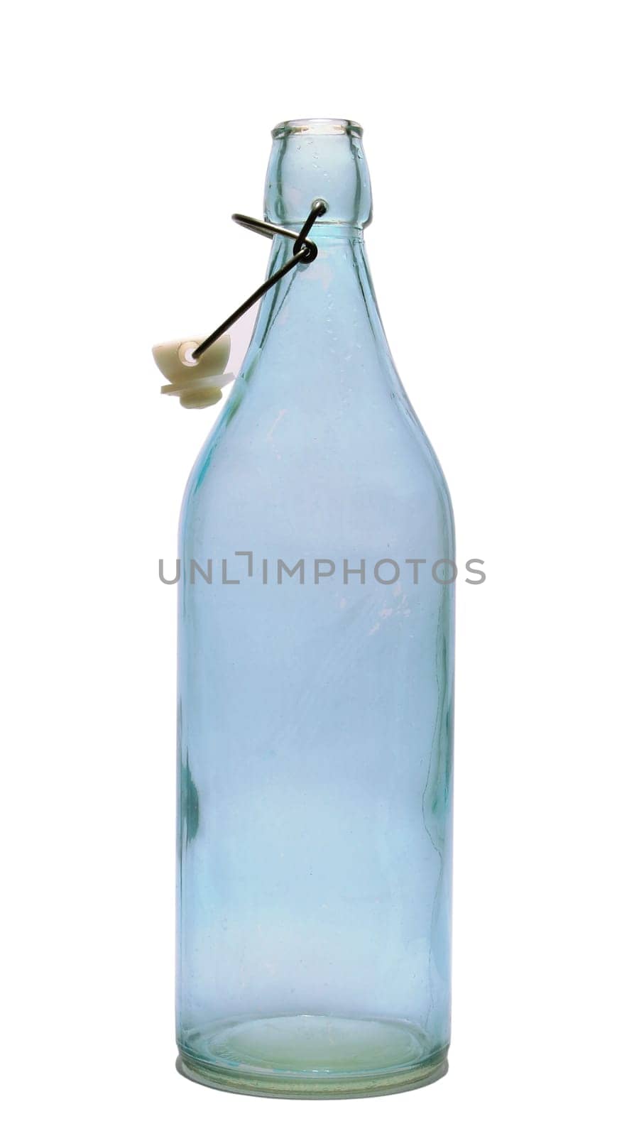 A slightly blue coloured, empty, glass bottle on a white background.