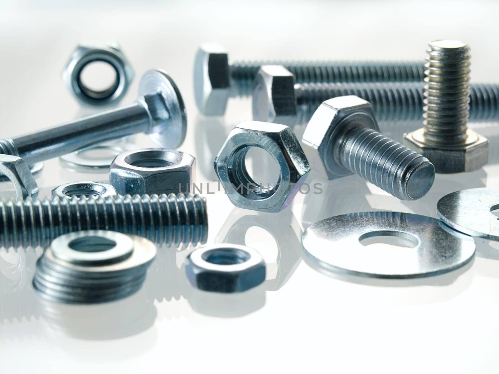 screws and nuts on a white background
