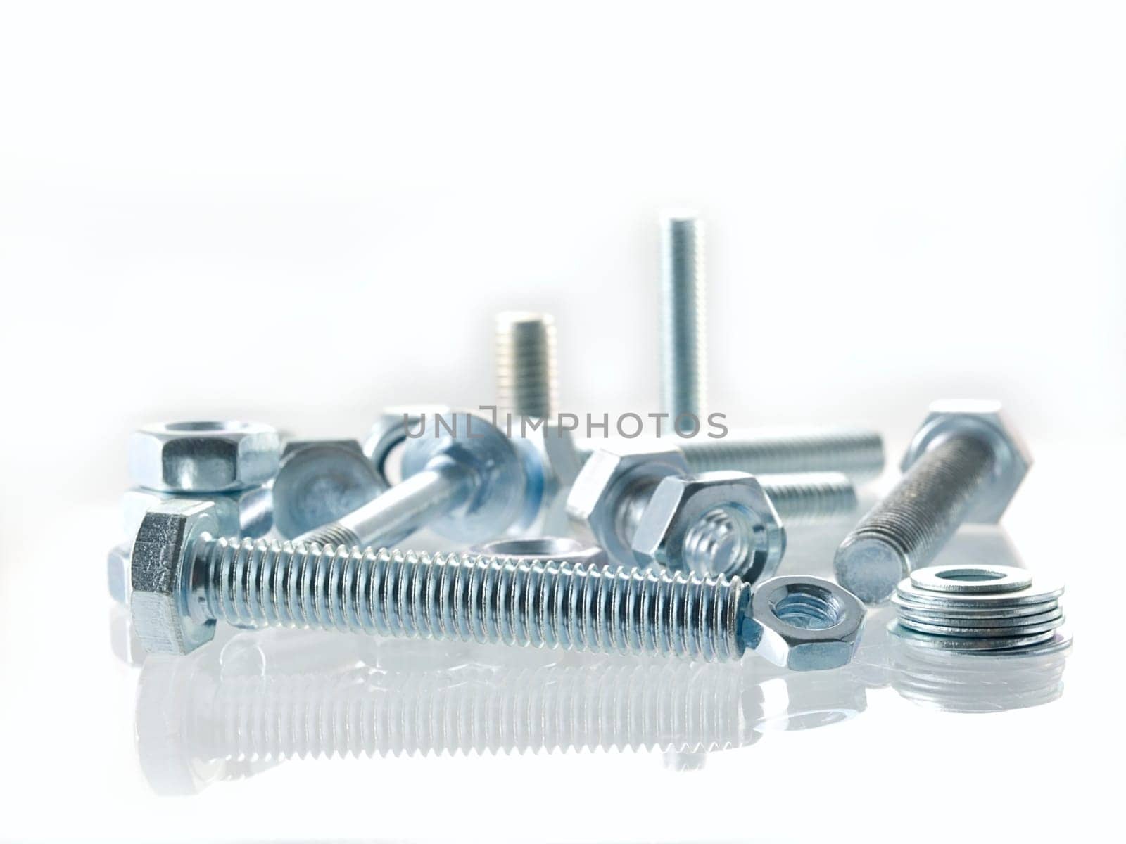 screws and nuts on a white background