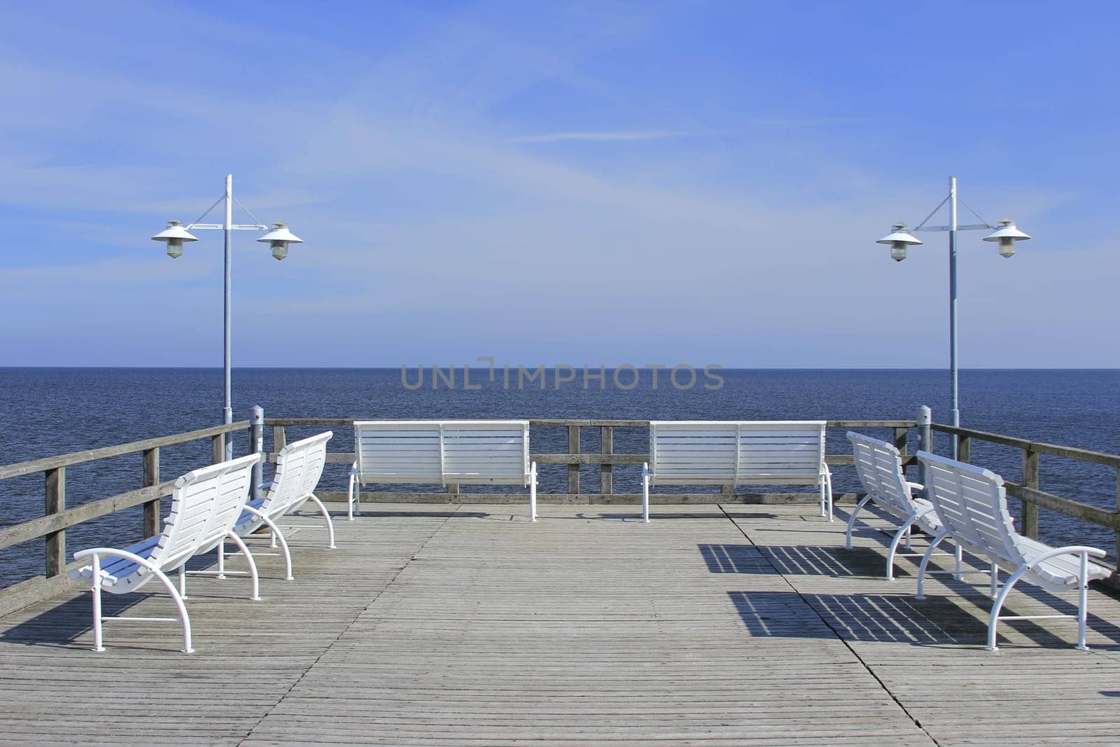 White benches on a pier on the island of Usedom,Baltic Sea,Mecklenburg-Western Pomerania,Germany