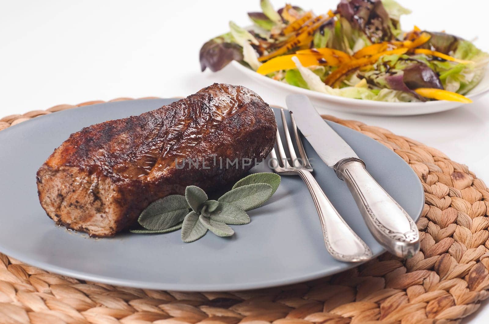 roasted pork tenderloin on grey plate