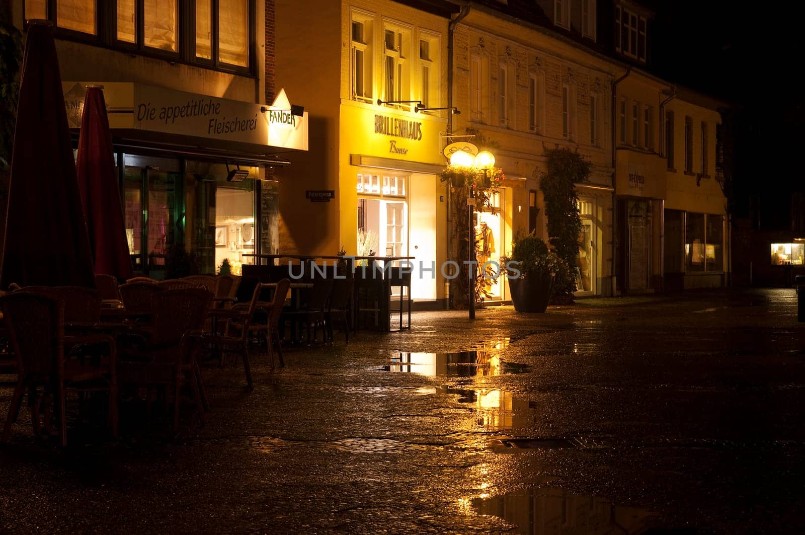 Old town Kempen at night with rain-soaked pavement