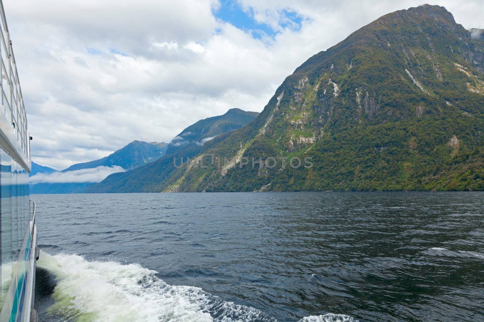 Traveling by boat through the channels of Doubtful Sound in New Zealand