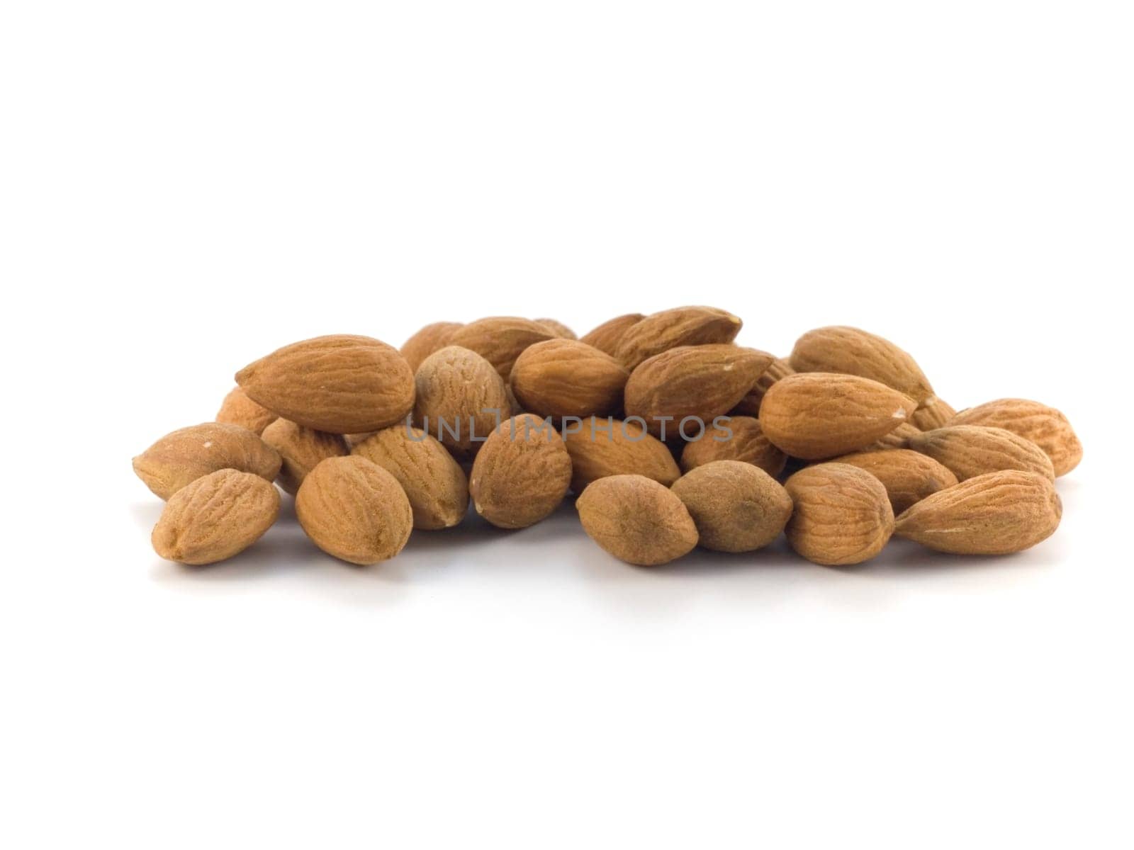 group of almonds isolated on white background