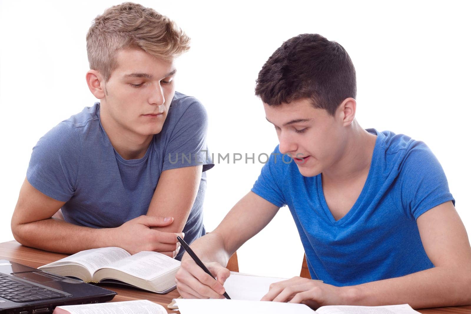 Two young guys studying Bible passages