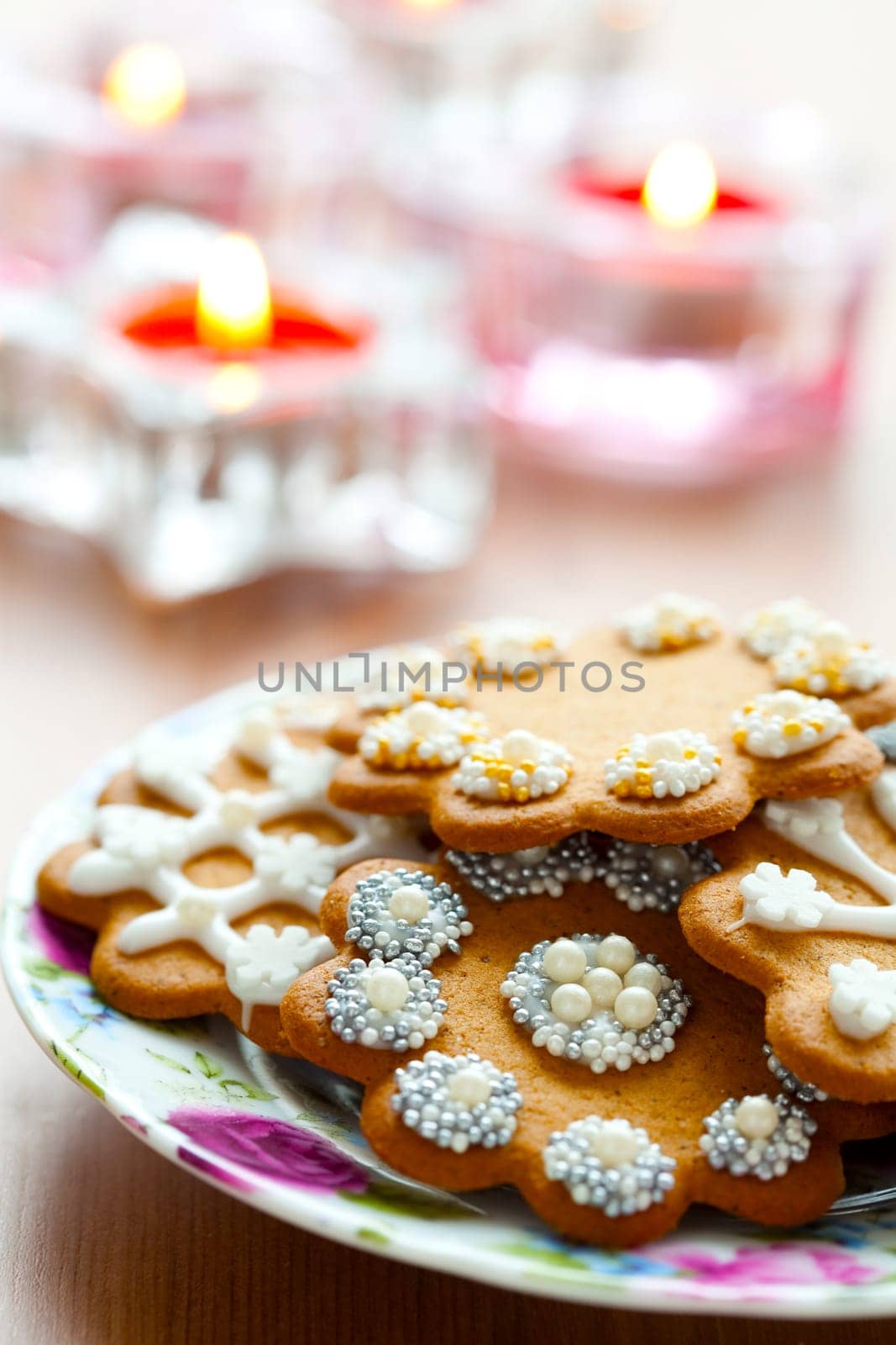 Close-up of delicious decorated Christmas gingerbread cookies with candles
