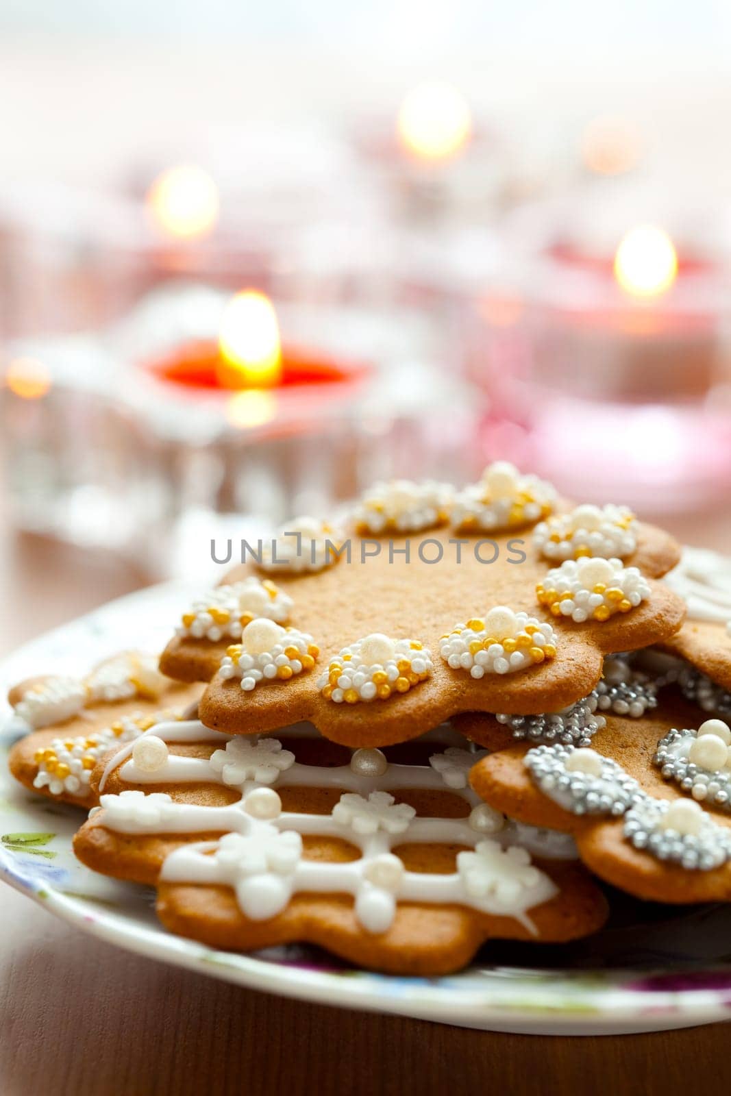 Close-up of delicious decorated Christmas gingerbread cookies with candles