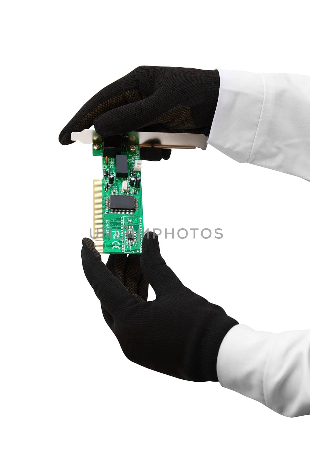 Hands with gloves hold chip on white