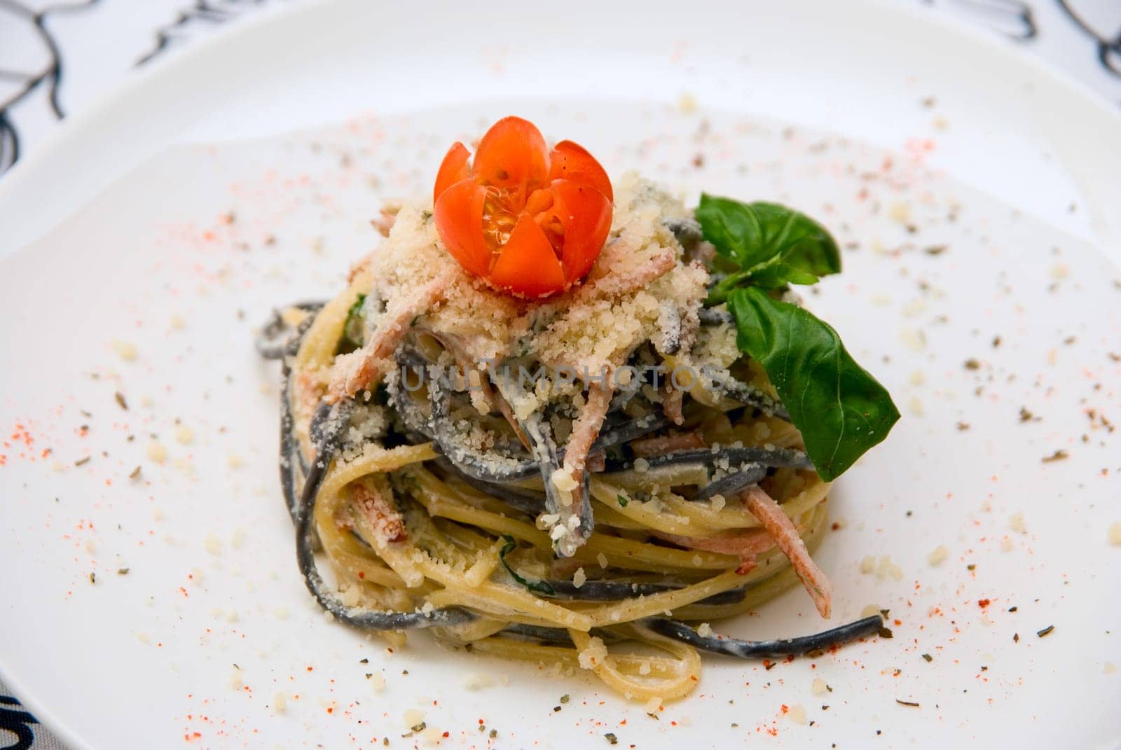 Close-up of Salad with spaghetti at plate.
