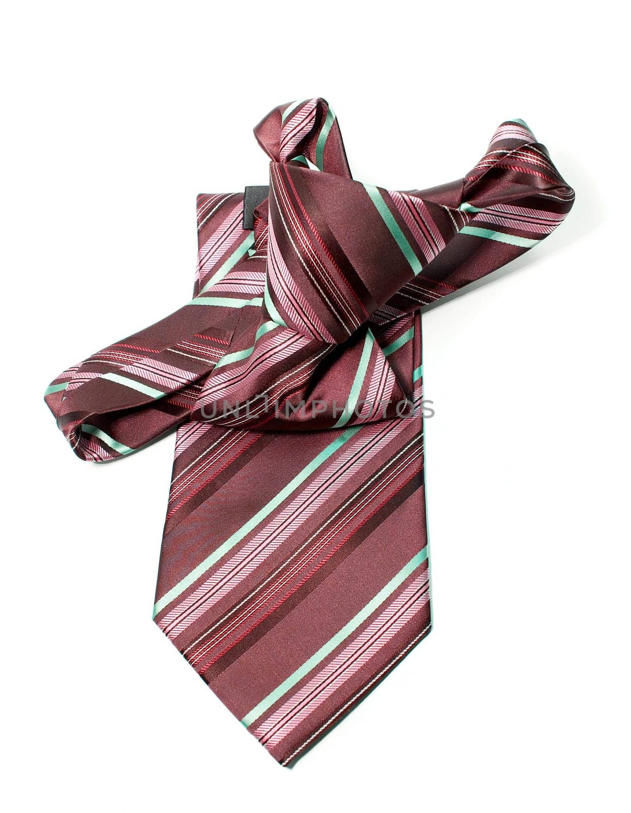 Red and green checkered man&#039 s necktie on white background
