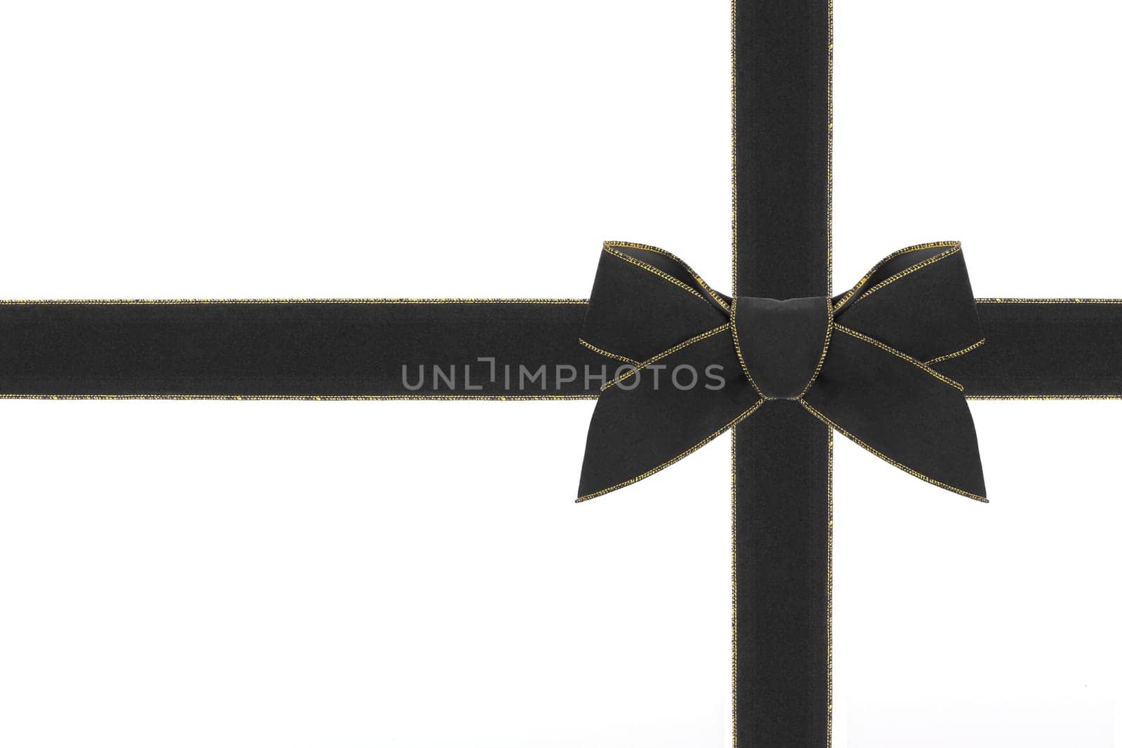 A black velvet bow with matching ribbon.