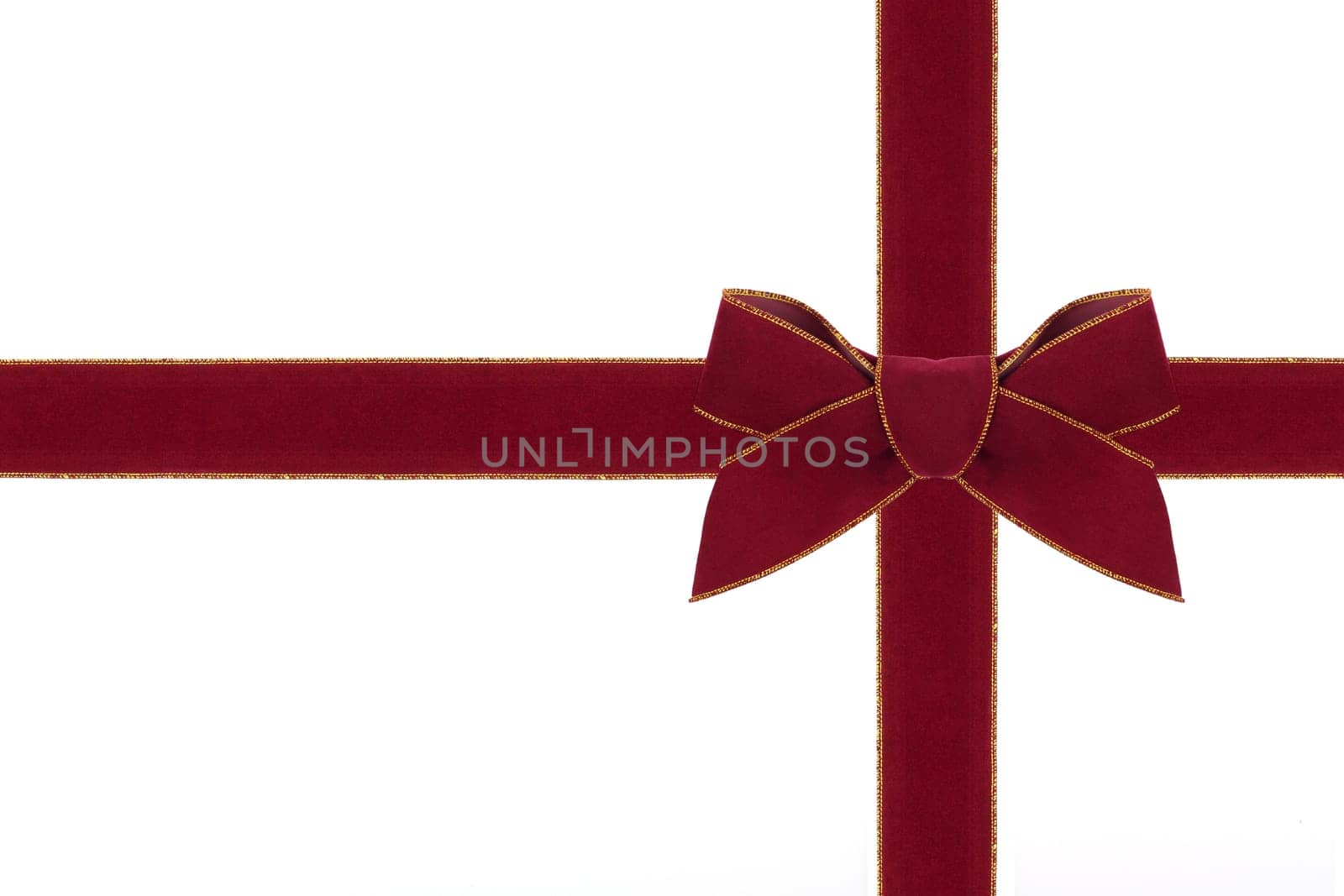 A red velvet bow with matching ribbon.