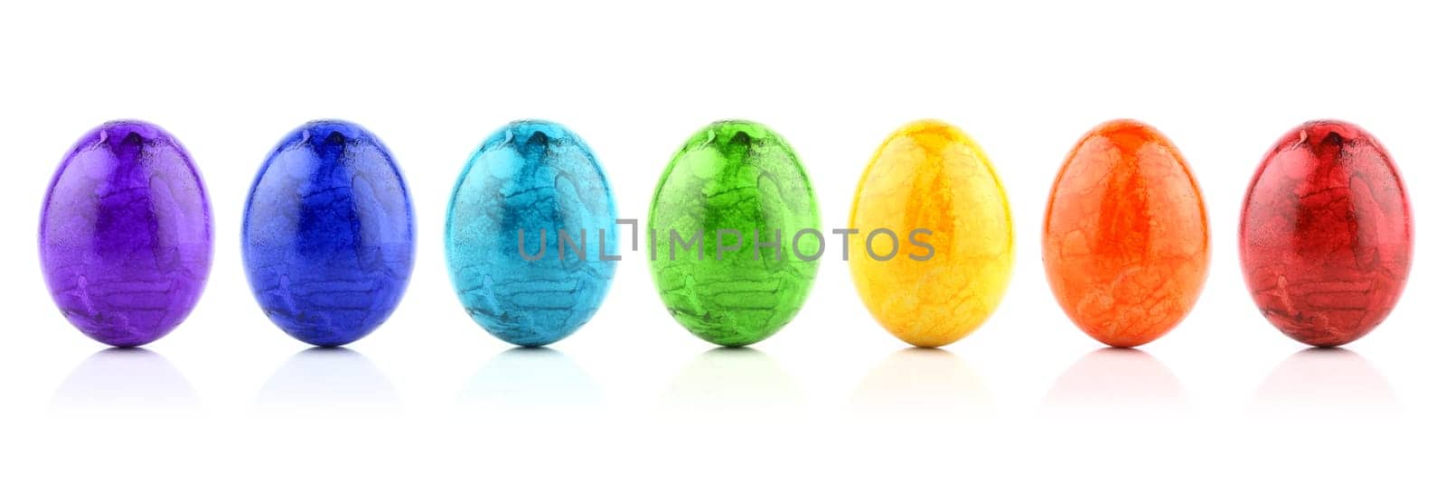 Colorful Easter eggs in rainbow colors in a row.