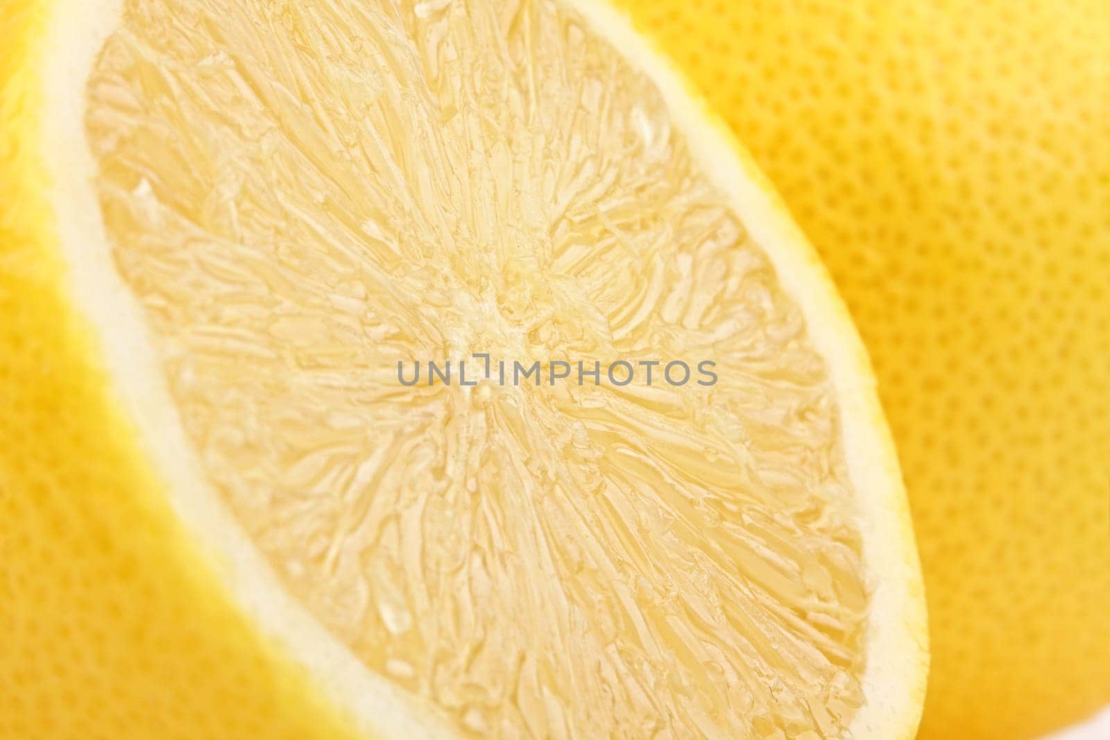 A freshly sliced lemon in profile.