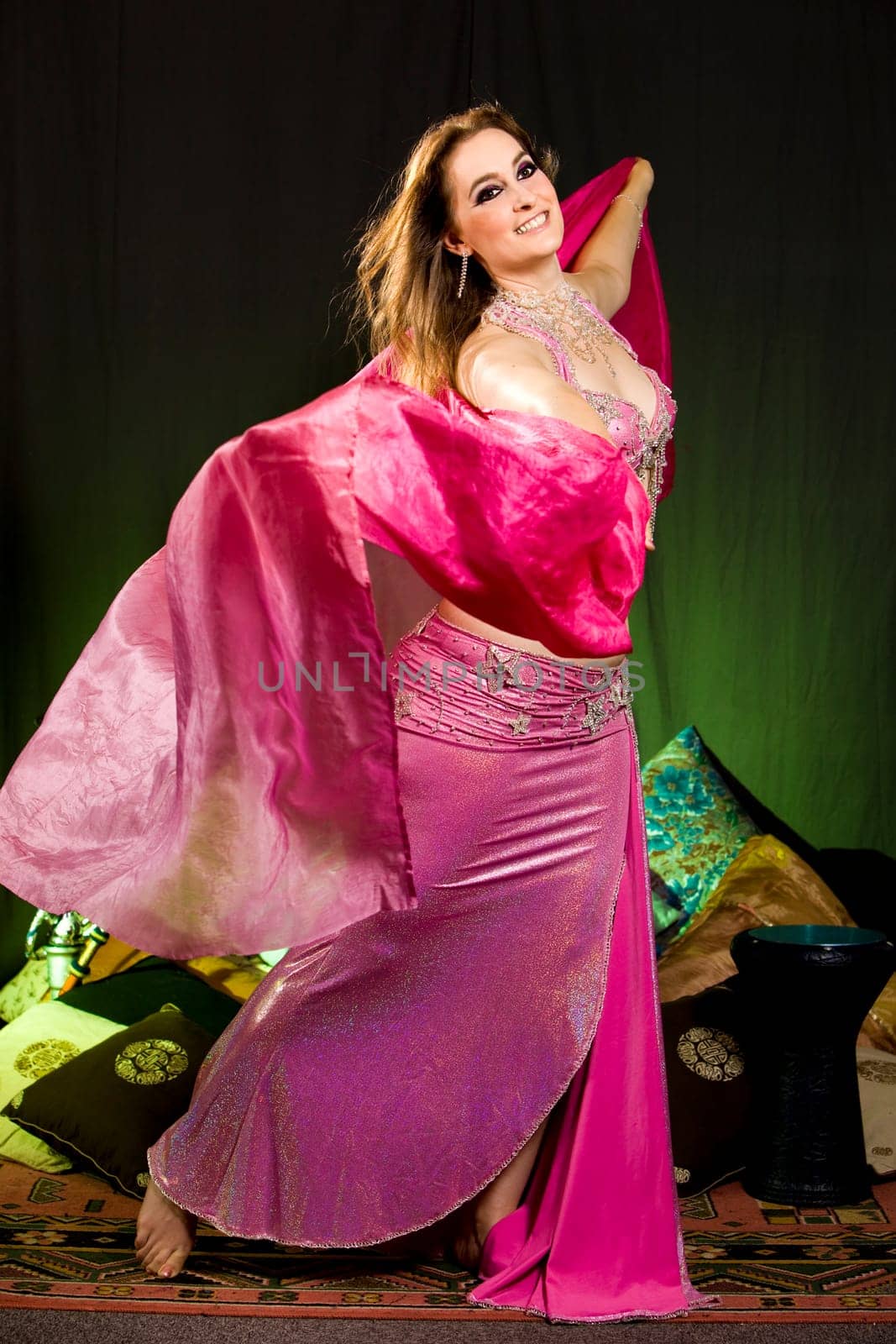 beautiful woman dancing the oriental style dance called belly dance