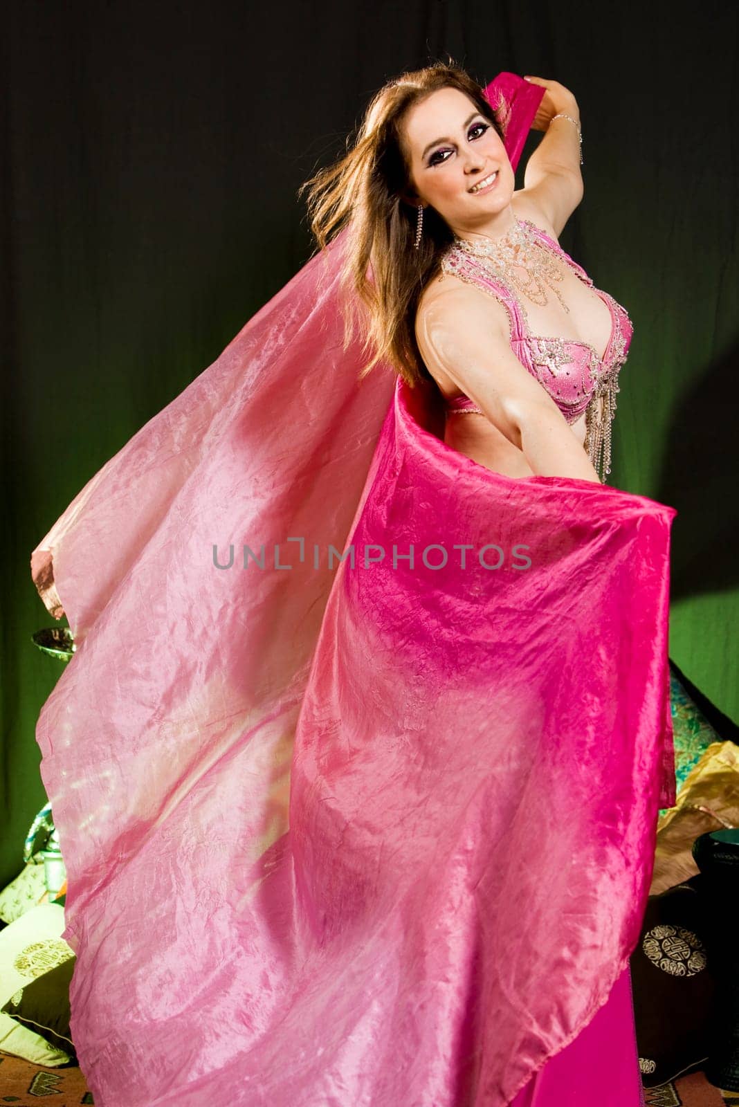 beautiful woman dancing the oriental style dance called belly dance