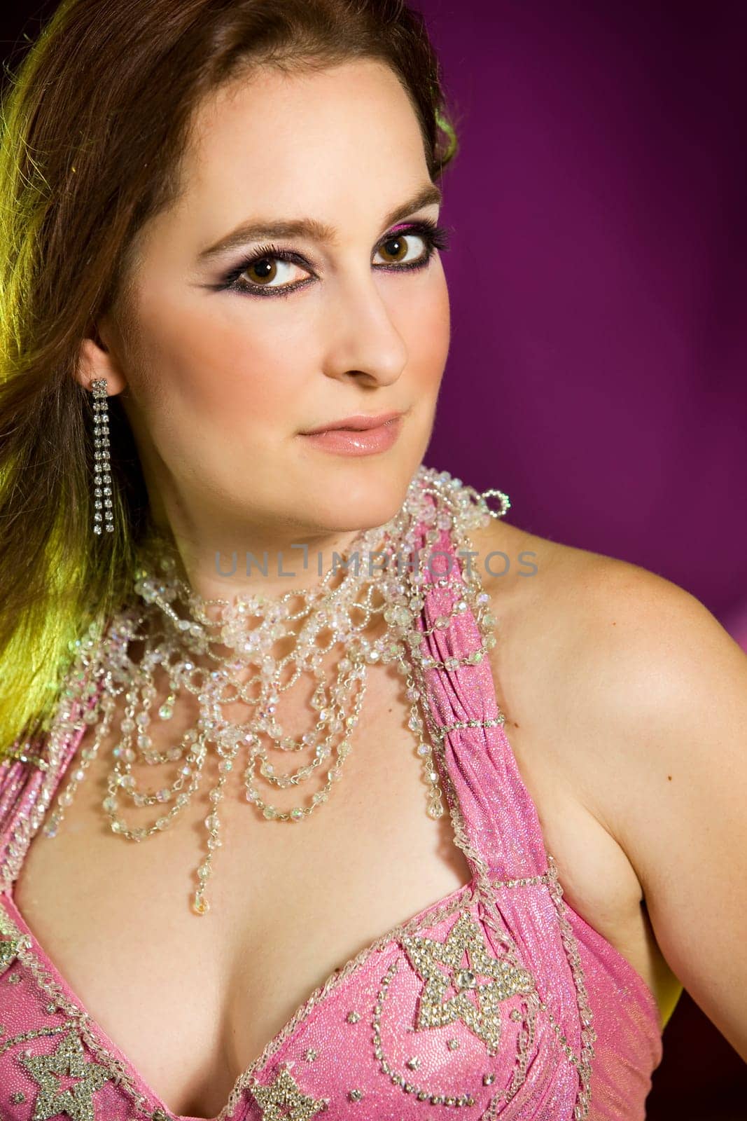 beautiful woman dancing the oriental style dance called belly dance