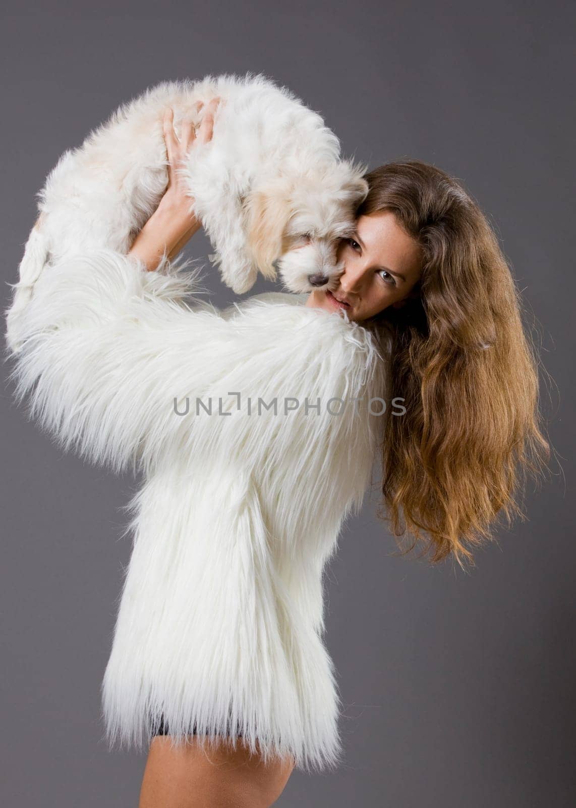 sexy attractive woman posing glamorous with her pet