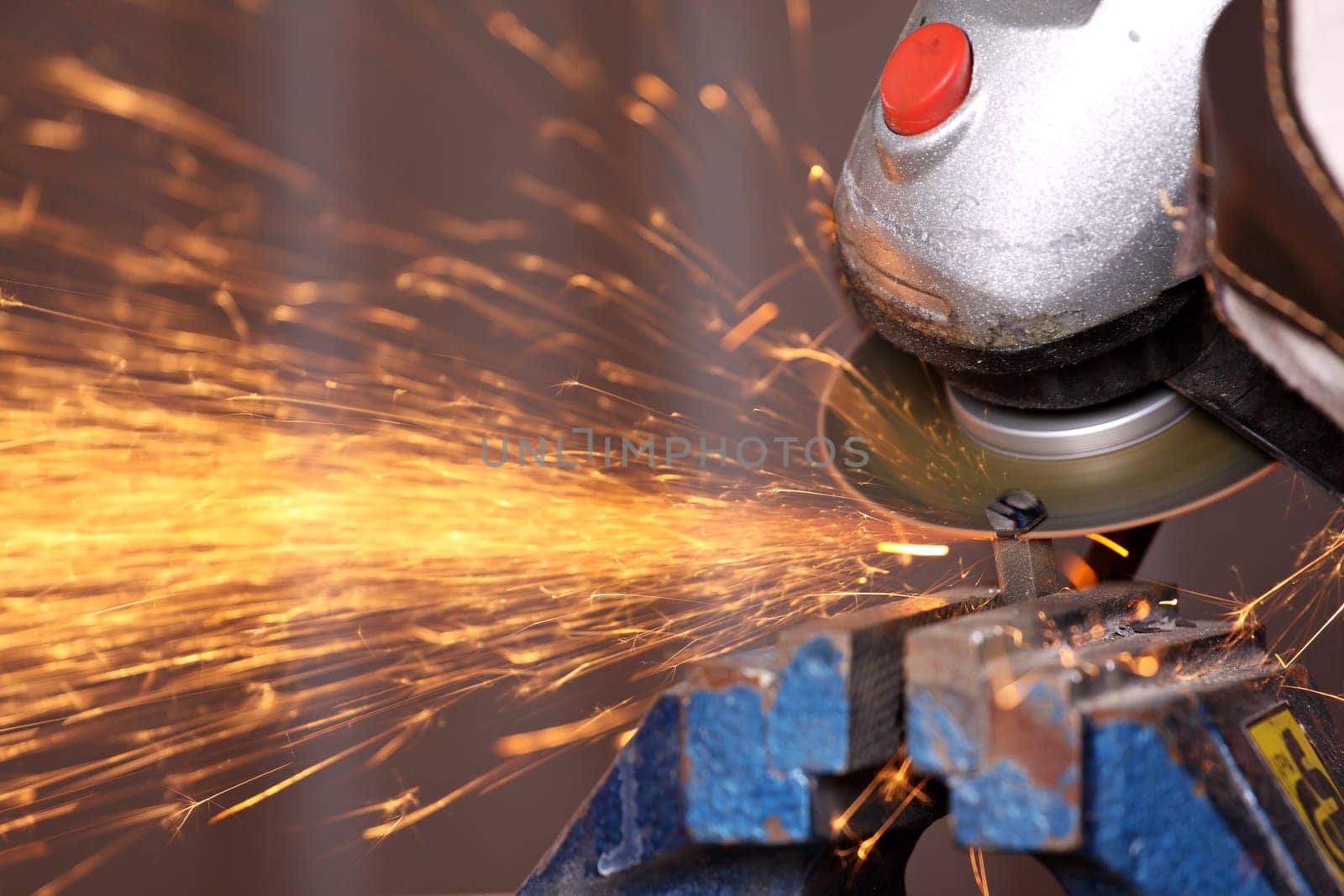 A cut-off grinder in use.