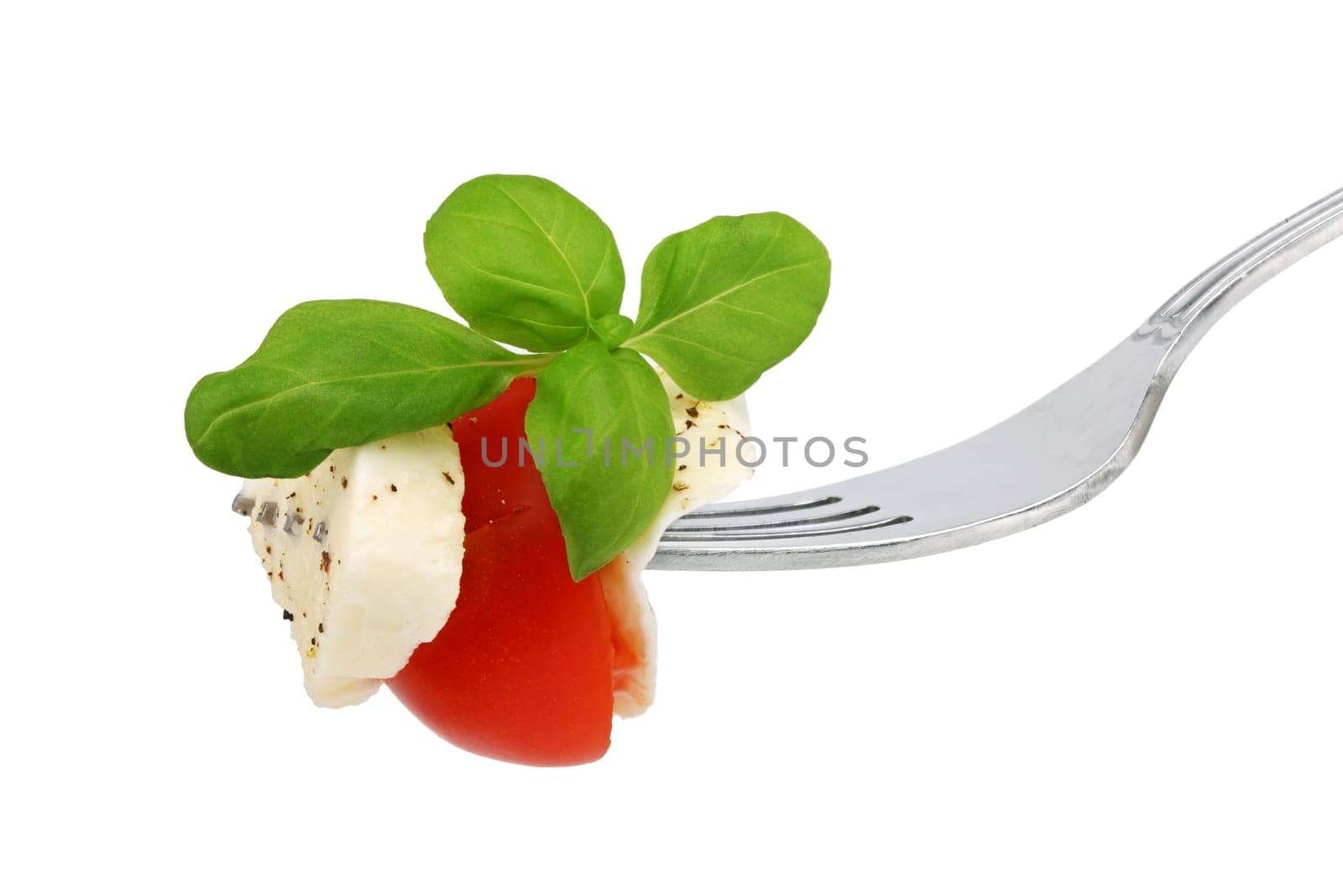 Italian cheese basalikum and tomtate on fork
