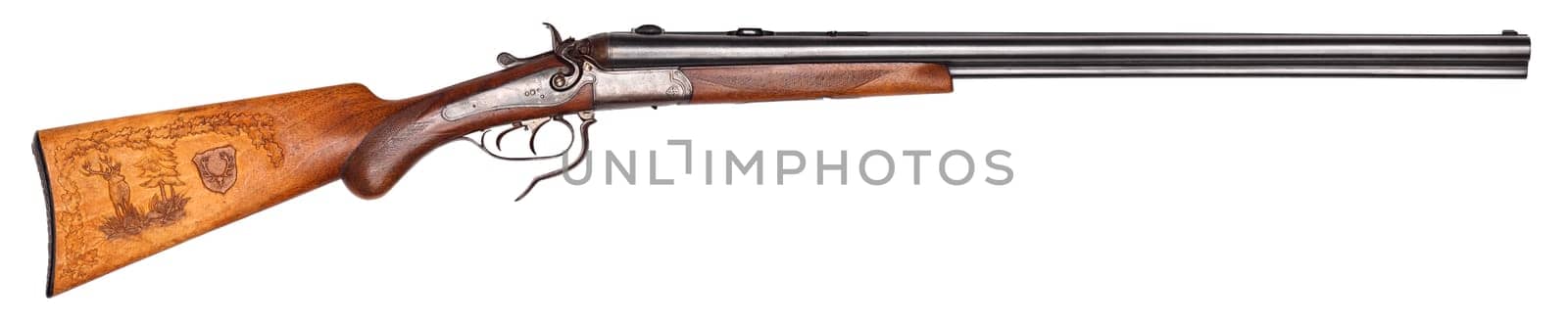 Old hunting rifle with carving isolated.