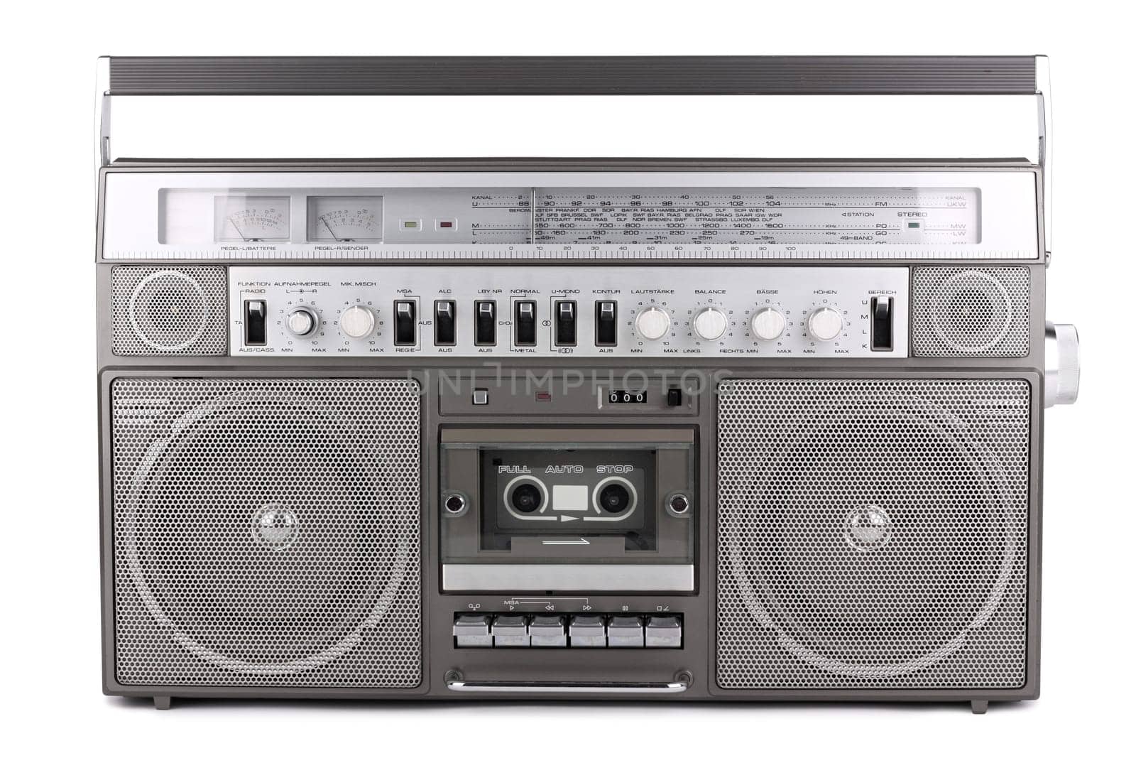 Old radio with cassette deck on white background