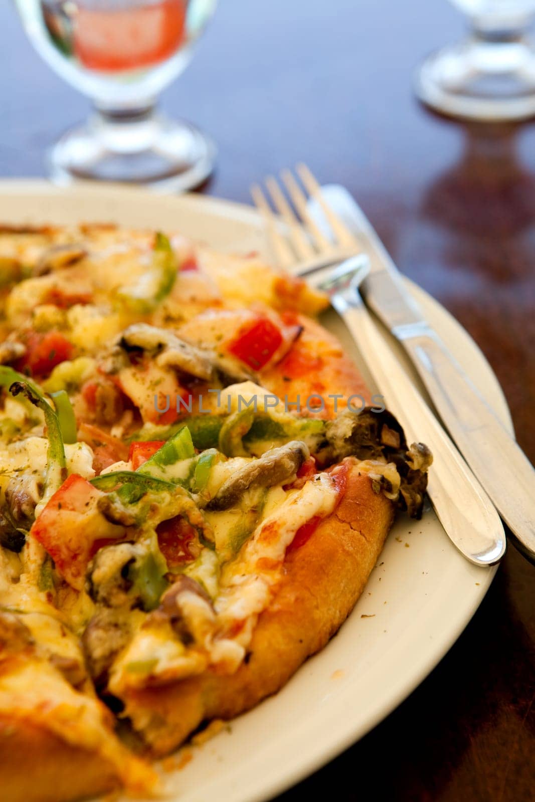 Close-up of a delicious pizza in a greek outdoor restaurant