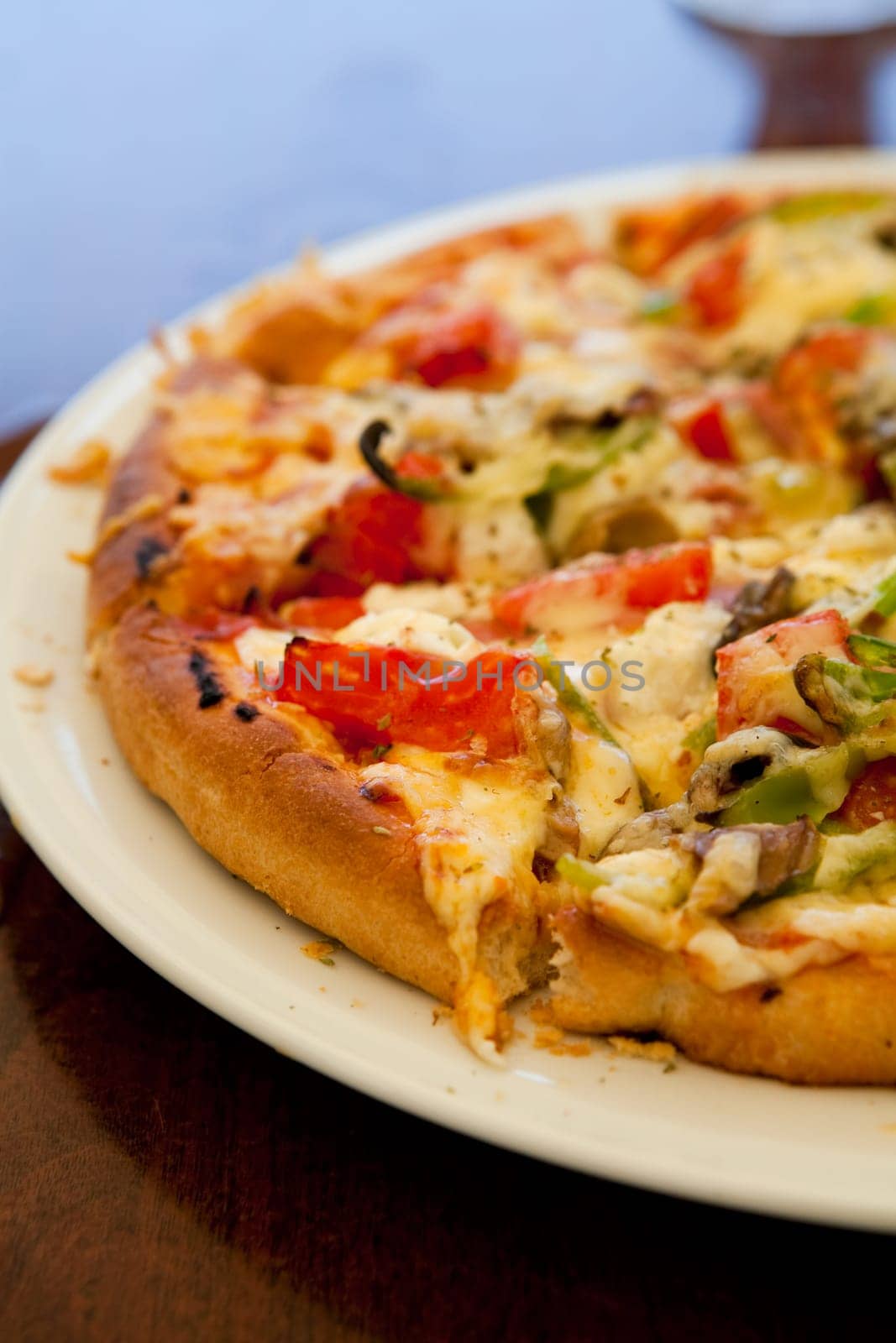 Close-up of a delicious pizza in a greek outdoor restaurant