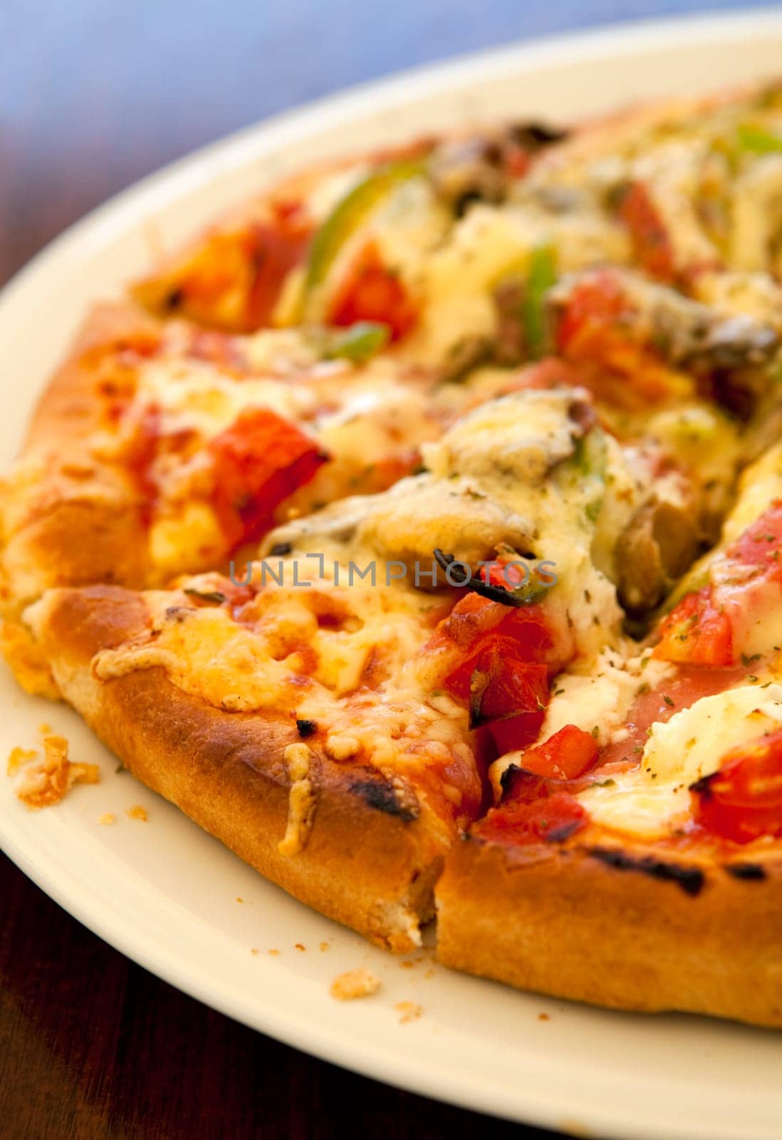 Close-up of a delicious pizza in a greek outdoor restaurant