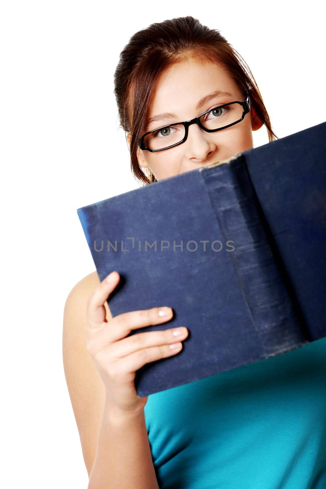 Young caucasian beautiful girl in glasses holding open book over white background.