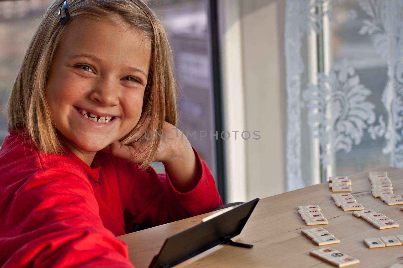 Girl plays rummikub