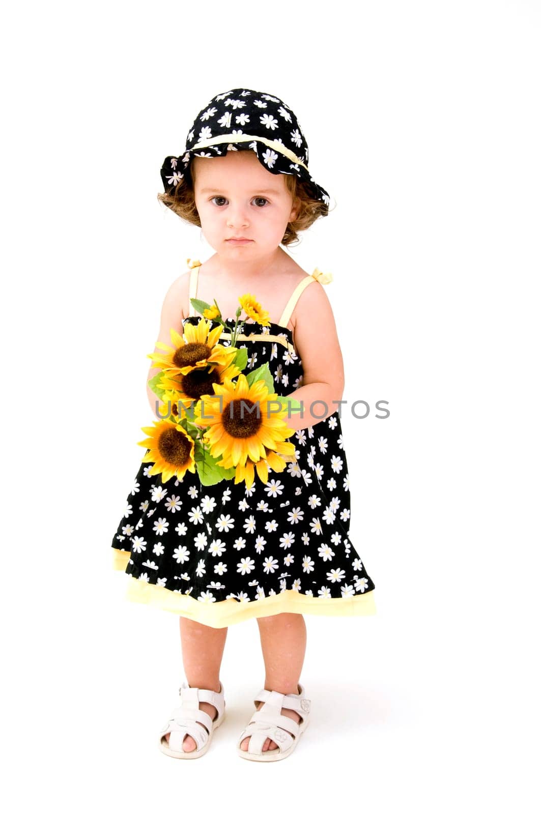 Baby Girl Smelling Flowers