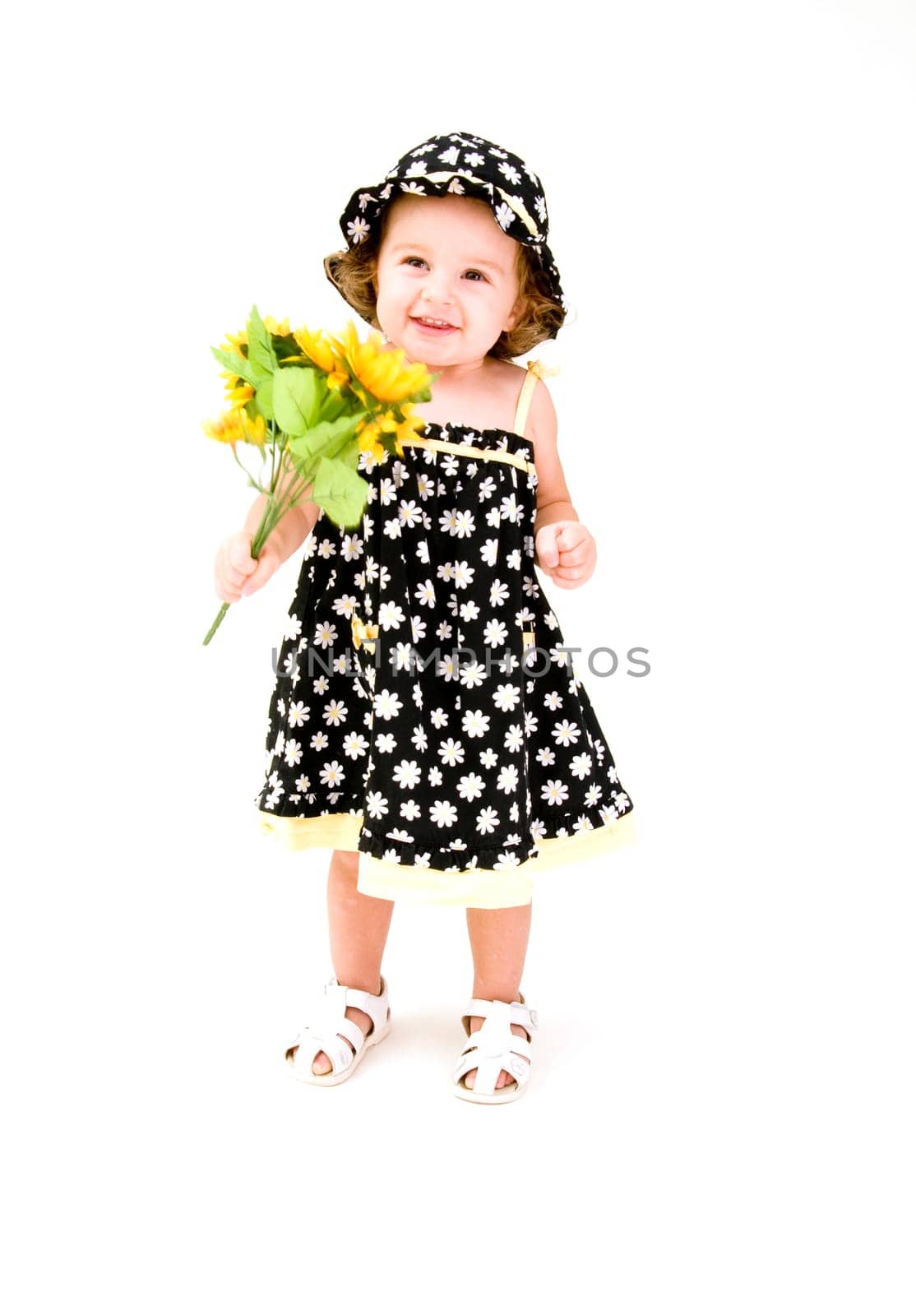 Baby Girl Smelling Flowers