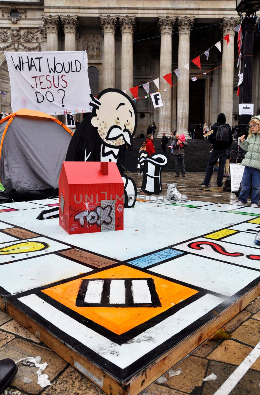 LONDON - OCTOBER 27: Occupy London encampment at St Paul&#039 s Cathedral on October 27, 2011 in London. Occupy London is a peaceful demonstration against economic inequality and social injustice.