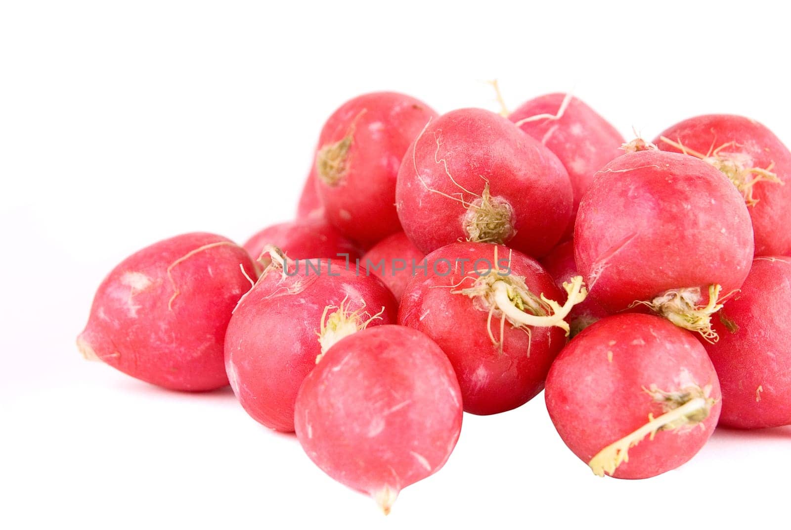 Red radishes isolated on white background