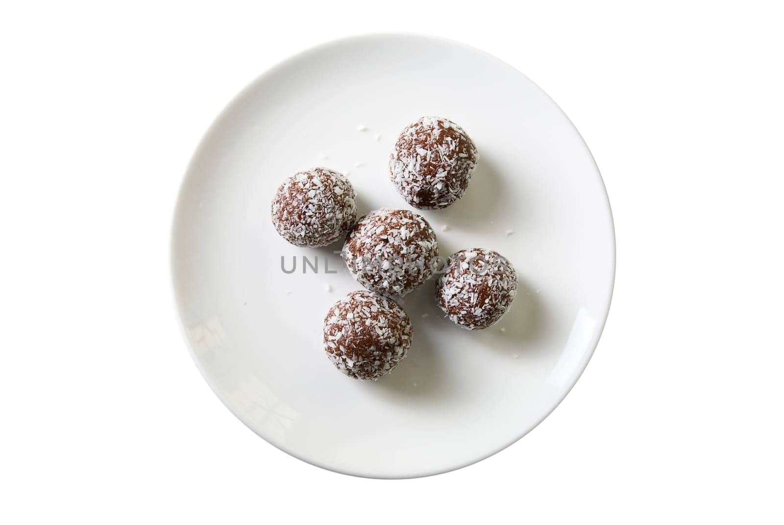 Chocolate ball cakes at plate isolated on white background