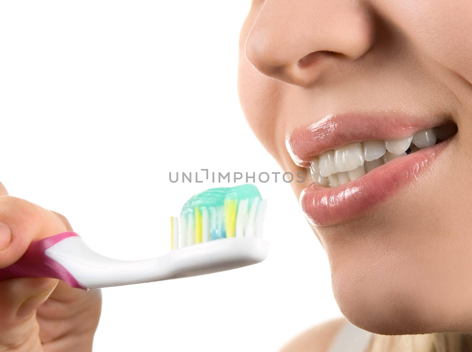 Close up of cleaning teeth on white